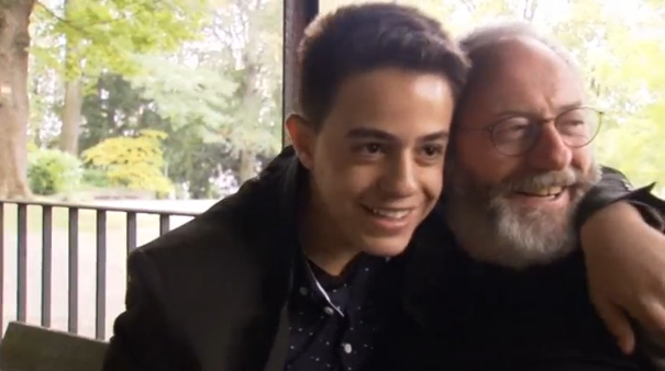 "Game of Thrones" actor Liam Cunningham visits Stuttgart to surprise a Syrian refugee he met in Jordan last month, after 16-year-old Hussam gained a visa and passport and moved to Germany. (Photo captured from Reuters video)