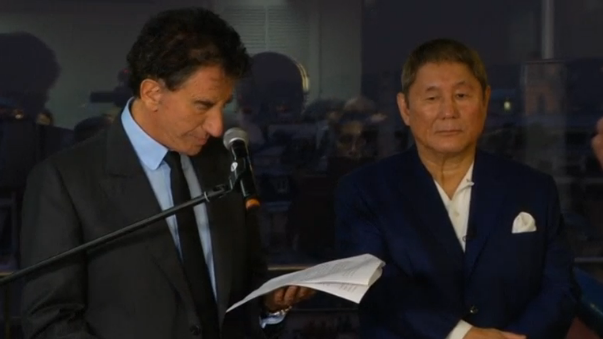 Japanese filmmaker Takeshi Kitano receives France's Legion of Honour at ceremony in Paris. (Photo captured from Reuters video)