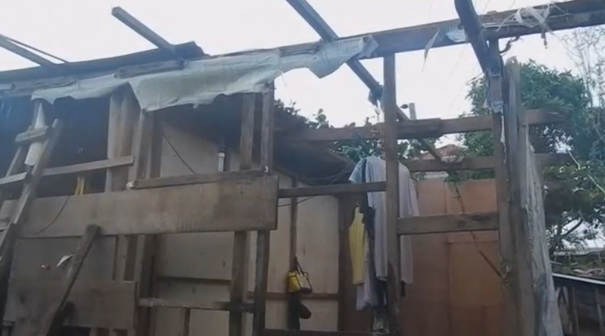 Residents living in the northern Philippines return to their homes after a super typhoon left behind a trail of destruction that killed at least 12 people. (Photo captured from Reuters video)