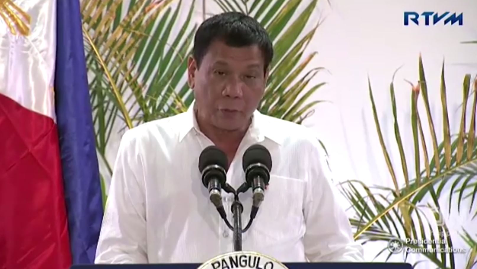 President Rodrigo Duterte delivers his "cuss-free" speech and press briefing at the Davao International AIrport upon his arrival from Japan. (photo grabbed from RTVM video)