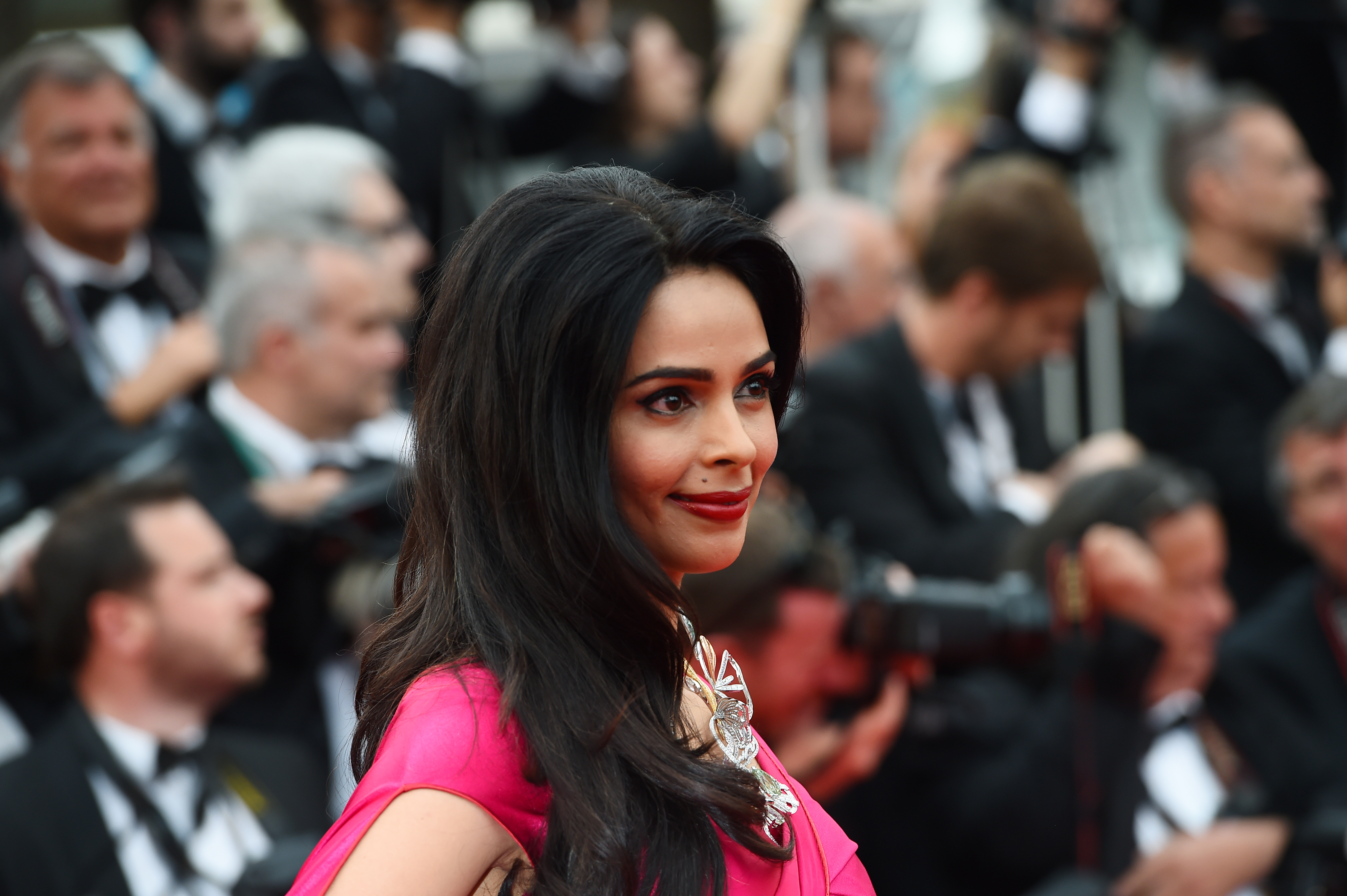 Indian model and actress Mallika Sherawat poses as she arrives for the screening of the film "Mad Max : Fury Road" during the 68th Cannes Film Festival in Cannes, southeastern France, on May 14, 2015.       AFP PHOTO / ANNE-CHRISTINE POUJOULAT / AFP PHOTO / ANNE-CHRISTINE POUJOULAT