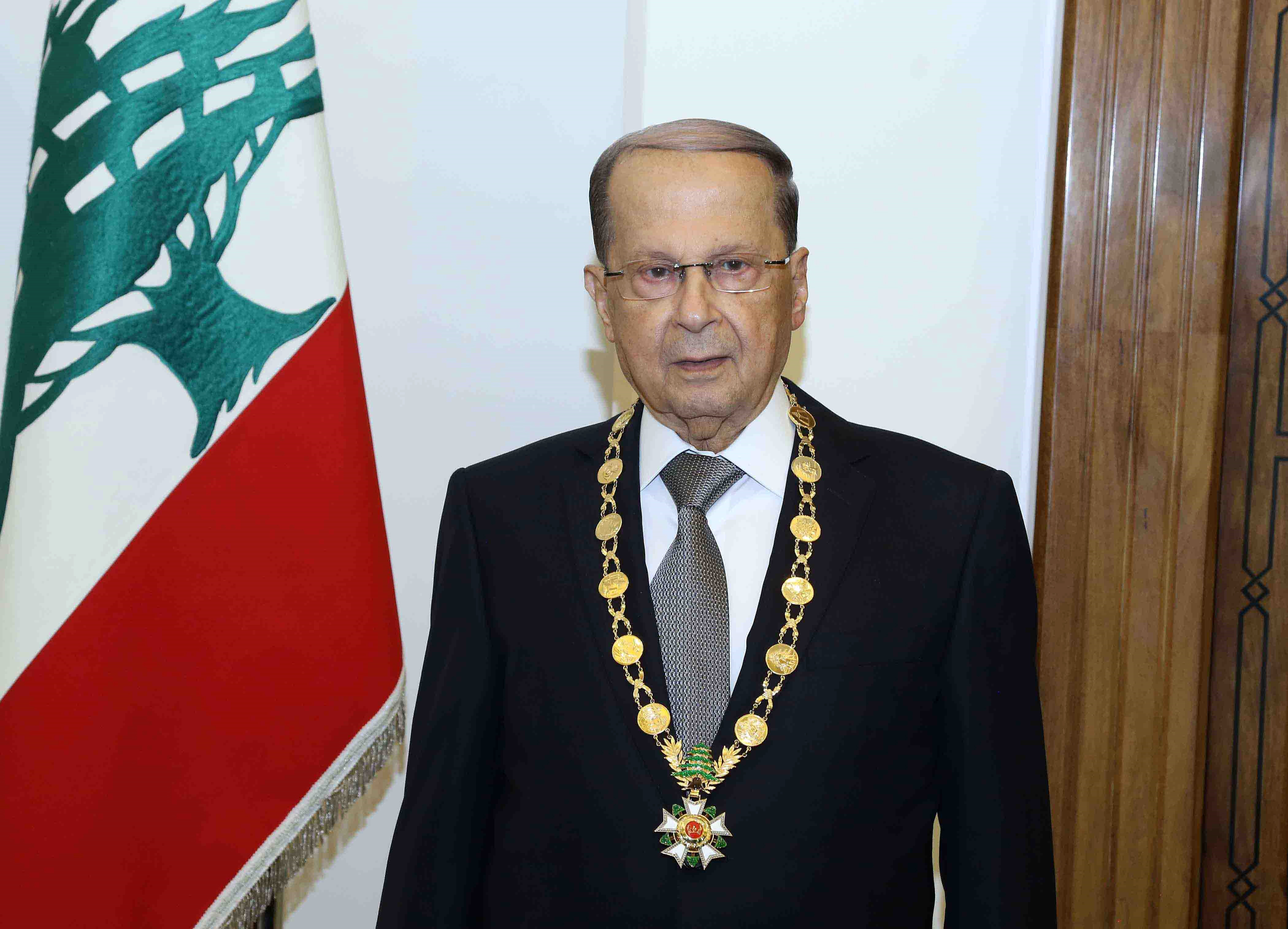A handout picture provided by the Lebanese Goverment Press Agency Dalati and Nohra on October 31, 2016 shows Lebanese President Michel Aoun posing with the presidential medal at the presidential palace of Baabda, east of Beirut on October 31, 2016.  Lebanese lawmakers ended a two-year political vacuum by electing as president ex-army chief Michel Aoun, who promised to protect the country from spillover from the war in Syria. / AFP PHOTO / DALATI AND NOHRA / HO / === RESTRICTED TO EDITORIAL USE - MANDATORY CREDIT "AFP PHOTO / HO / DALATI AND NOHRA" - NO MARKETING - NO ADVERTISING CAMPAIGNS - DISTRIBUTED AS A SERVICE TO CLIENTS ===