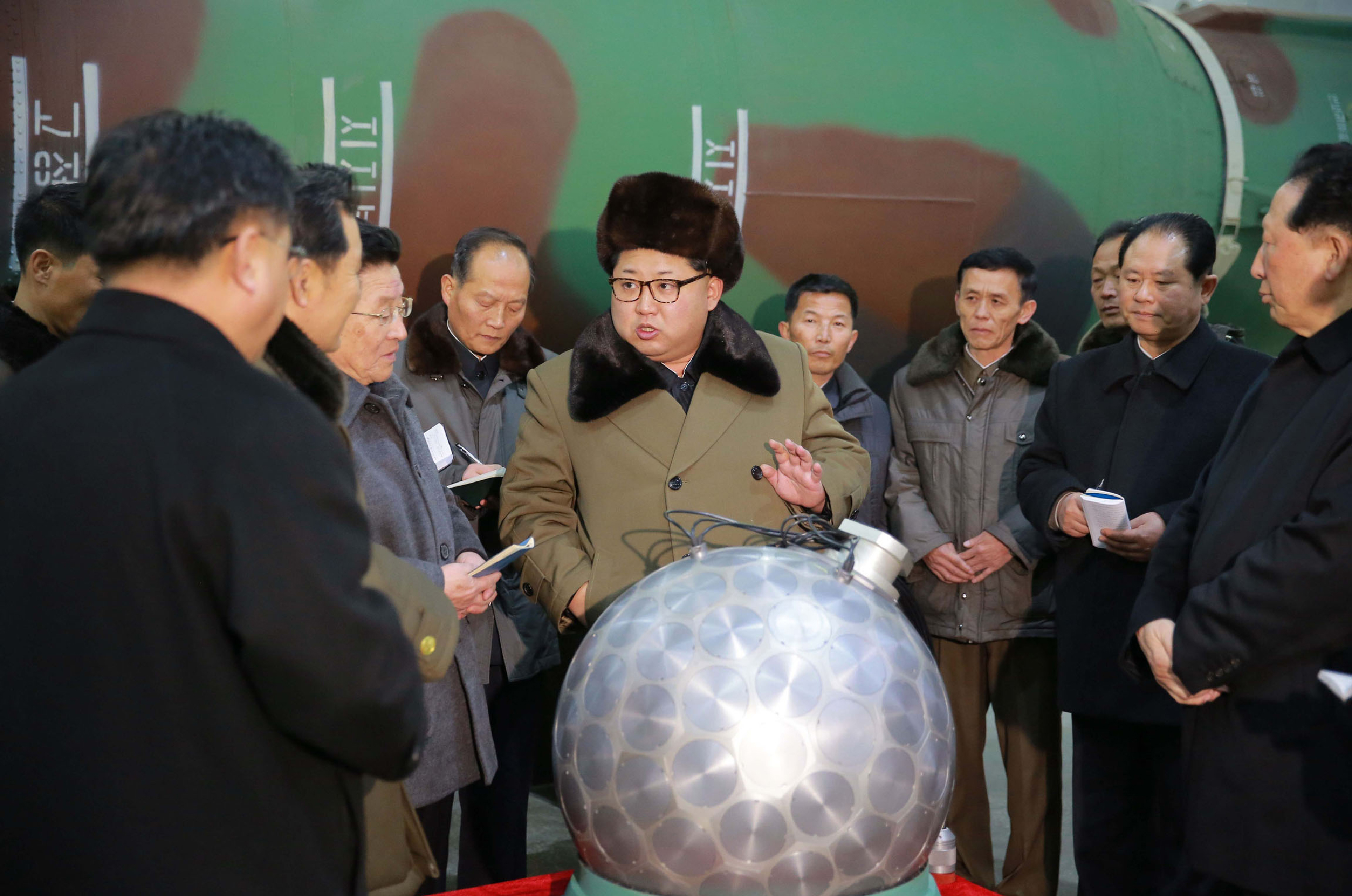 (FILES) This undated file picture released from North Korea's official Korean Central News Agency (KCNA) on March 9, 2016 shows North Korean leader Kim Jong-Un (C) meeting with the scientists and technicians in the field of researches into nuclear weapons and guiding the work for boosting the nuclear arsenal at an undisclosed location. Among the many challenges facing the next occupant of the White House, few will be more pressing, or more complex, than that posed by North Korea's seemingly inexorable drive to nuclear statehood. Pyongyang's weapons programme has accelerated sharply in this US election year, with two nuclear tests and around 25 missile tests in defiance of multiple UN resolutions and sanctions. / AFP PHOTO / KCNA / KCNA