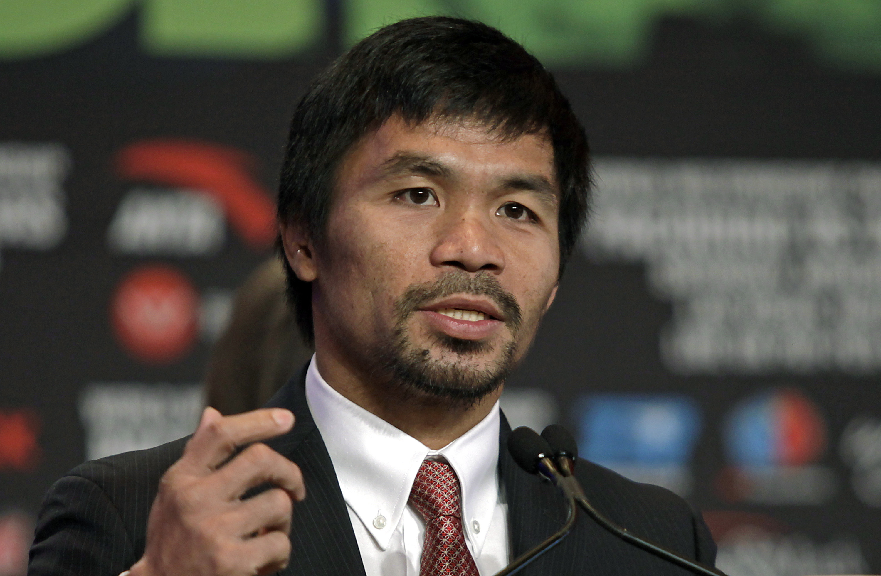 Boxer Manny Pacquiao of the Philippines speaks during a news conference at The Wynn Las Vegas on November 2, 2016. Pacquiao will challenge Jessie Vargas of the US for the WBO Welterweight Championship on November 5 at the Thomas & Mack Center in Las Vegas. / AFP PHOTO / John GURZINSKI