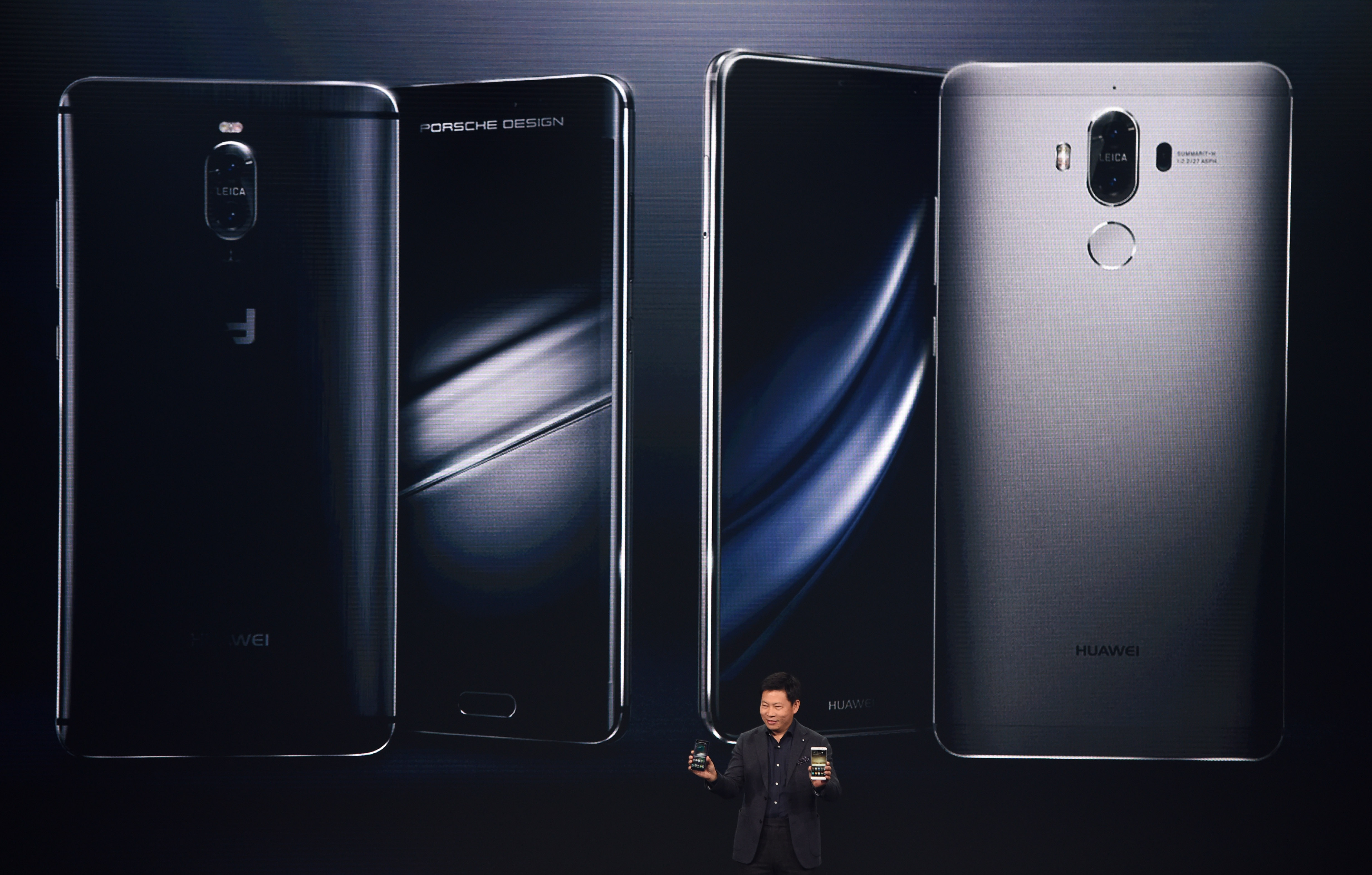 Richard Yu, CEO of Huawei Consumer Business Group, presents the new Huawei Mate 9 high-end-phablet during the Huawei Global Product Launch in Munich, southern Germany, on November 3, 2016. / AFP PHOTO / CHRISTOF STACHE