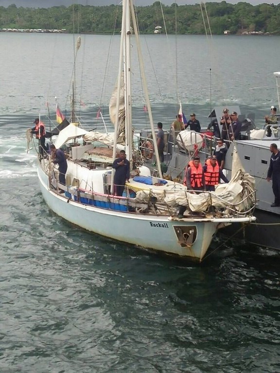 This recent undated handout photo released on November 7, 2016 by the Philippine military Western Mindanao Command (WESMINCOM) shows navy personnel aboard the yatch Rockall after it was recovered off Laparan island, in Sulu province. Islamic militants who specialise in kidnappings-for-ransom have reported killing a German sailor and abducting her elderly male companion from their yacht in waters off the southern Philippines, the military said on November 7. / AFP PHOTO / Western Mindanao Command / STR / -----EDITORS NOTE --- RESTRICTED TO EDITORIAL USE - MANDATORY CREDIT "AFP PHOTO / Western Mindanao Command (WESMINCOM)" - NO MARKETING - NO ADVERTISING CAMPAIGNS - DISTRIBUTED AS A SERVICE TO CLIENTS