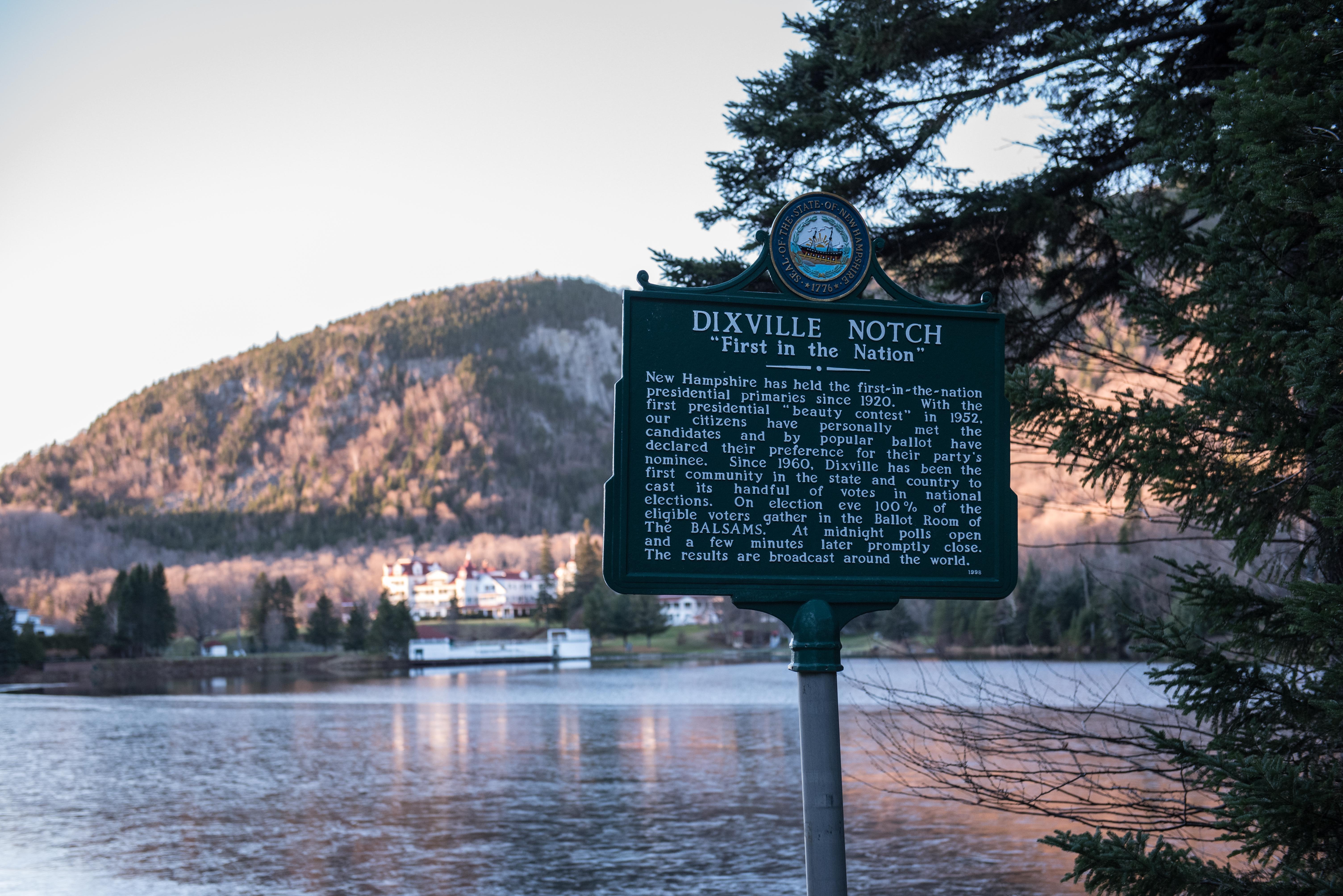 A sign indicating the village of Dixville Notch in New Hampshire, seen November 7, 2016, is where the first voting takes place in the 2016 US presidential election. The US presidential election got underway -- on a small scale -- as seven people in a tiny New Hampshire village cast their ballots at the stroke of midnight. Dixville Notch has had the honor of launching the voting, symbolically, since 1960. Clay Smith was the first of seven people to cast their ballots as Tuesday's long awaited Election Day began. An eighth resident voted by absentee ballot. / AFP PHOTO / Alice Chiche