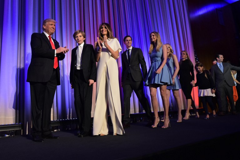 Republican presidential elect Donald Trump (L) arrives with his family to speak during election night at the New York Hilton Midtown in New York on November 9, 2016. / AFP PHOTO / Mandel NGAN