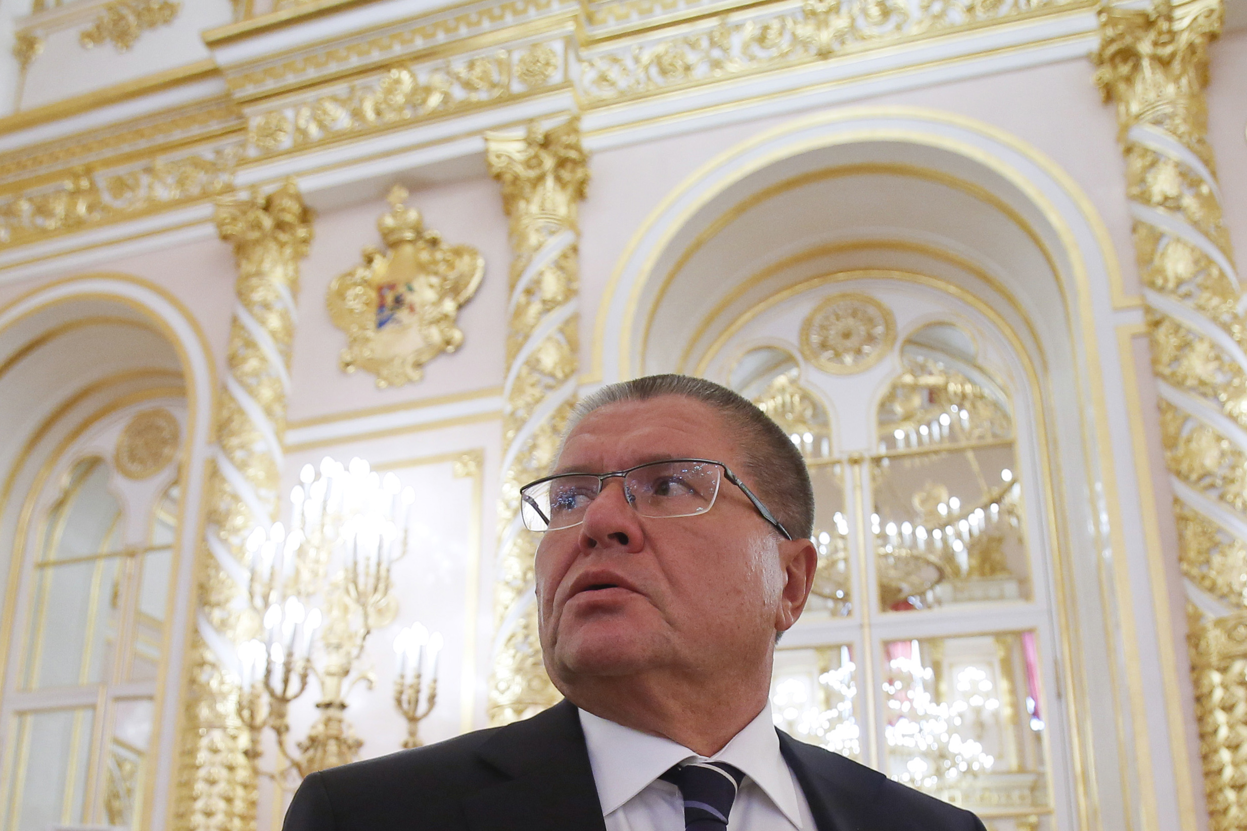(FILES) This file photo taken on September 18, 2014 shows Russian Economy Minister Alexei Ulyukayev looking on before a meeting of the State Council at the Kremlin in Moscow. Russia's Investigative Committee said Tuesday that it had detained Economy Minister Alexei Ulyukayev on suspicion of taking a two-million-dollar bribe over a massive deal involving state-controlled oil giant Rosneft. / AFP PHOTO / POOL / MAXIM SHEMETOV