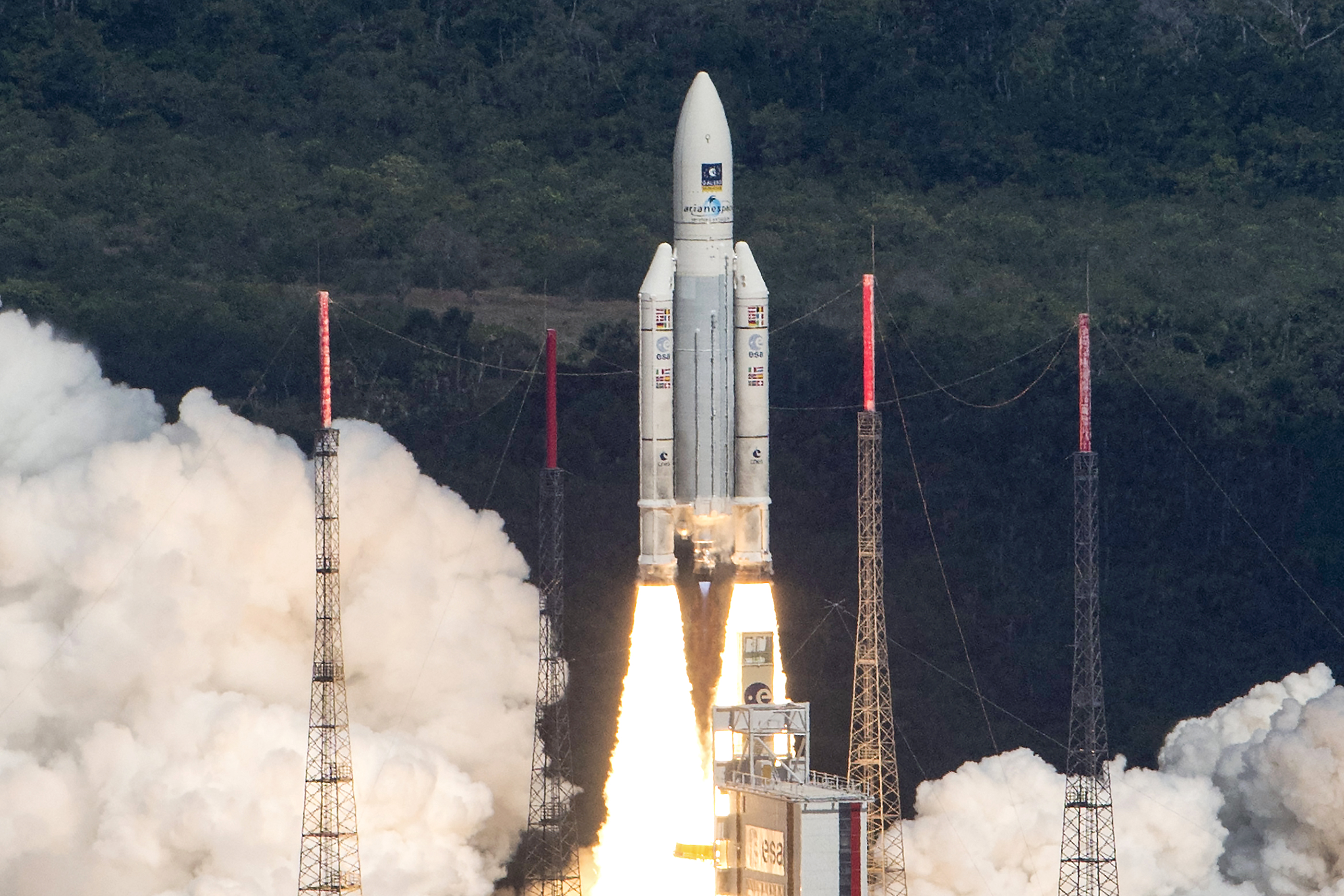 This handout photo taken and released on November 17, 2016 by the European Space Agency (ESA) shows an Ariane 5 space rocket with a payload of four Galileo satellites lifting off from ESA's European Spaceport in Kourou, French Guiana.  Ariane 5 successfully launched on November 17 four satellites which will be part of the Galileo global satellite navigation system. / AFP PHOTO / EUROPEAN SPACE AGENCY / Stephane Corvaja / RESTRICTED TO EDITORIAL USE - MANDATORY CREDIT "AFP PHOTO / STEPHANE CORVAJA / EUROPEAN SPACE AGENCY" - NO MARKETING NO ADVERTISING CAMPAIGNS - DISTRIBUTED AS A SERVICE TO CLIENTS