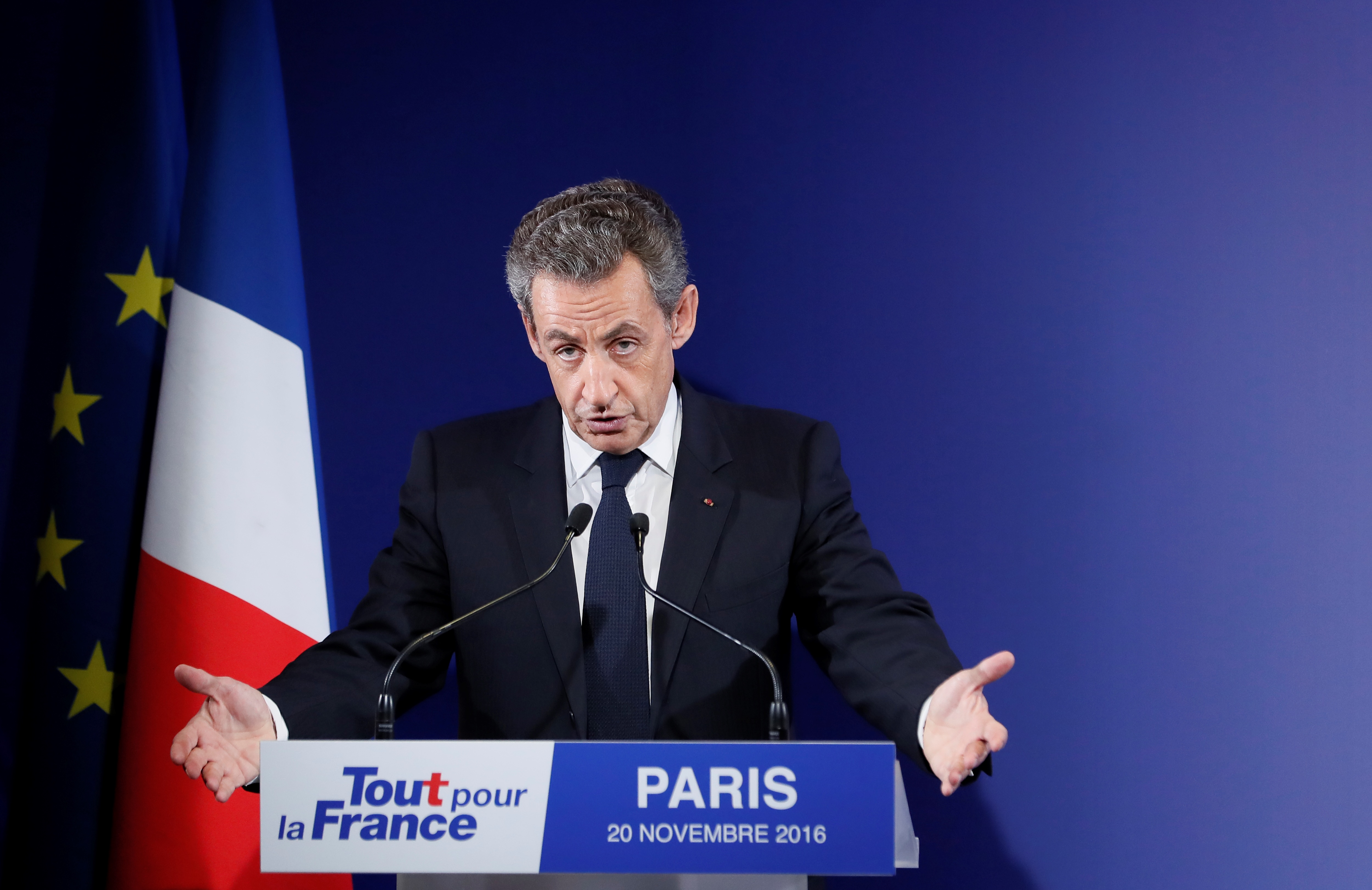 Former French President and candidate for the French right-wing presidential primary  Nicolas Sarkozy delivers a speech at his campaign headquarters after the vote's first round, on November 20, 2016 in Paris.  Francois Fillon took a commanding lead in the two-round primary that is widely expected to decide the country's next leader. In a major upset, Fillon had more than 43 percent of the vote to 26.7 percent for former prime minister Alain Juppe and just under 23 percent for Nicolas Sarkozy, according to the official tallies.  / AFP PHOTO / POOL / IAN LANGSDON
