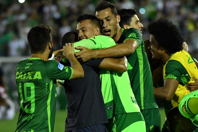 (FILES) This file photo taken on November 23, 2016 shows Brazil's Chapecoense goalkeeper Danilo celebrating after defeating Argentina's San Lorenzo during their 2016 Copa Sudamericana semifinal second leg football match held at Arena Conda stadium, in Chapeco, Brazil. A plane carrying 81 people, including members of a Brazilian football team, crashed late on November 28, 2016 near the Colombian city of Medellin, officials said. The survivors, two crew members and three players of Chapecoense Real Alan Ruschel, goalkeeper Danilo and Jackson Follman were transferred to local hospitals, according to radio Caracol. / AFP PHOTO / NELSON ALMEIDA