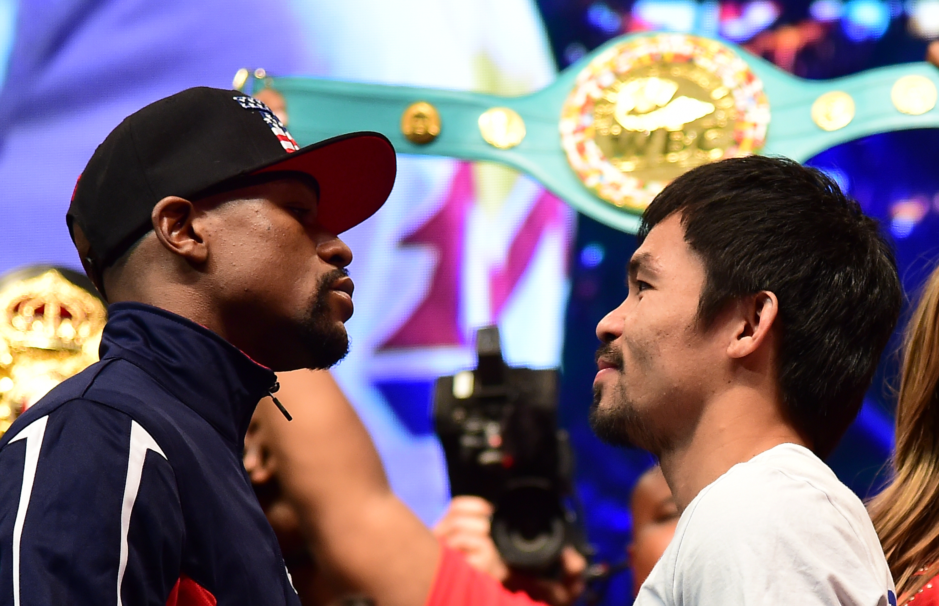 Floyd Mayweather and Manny Pacquiao face off following their weigh-in on May 1, 2015 in Las Vegas, Nevada one day before their "Fight of the Century" on May 2 at the MGM Grand Garden Arena. AFP PHOTO / FREDERIC J. BROWN / AFP PHOTO / FREDERIC J. BROWN