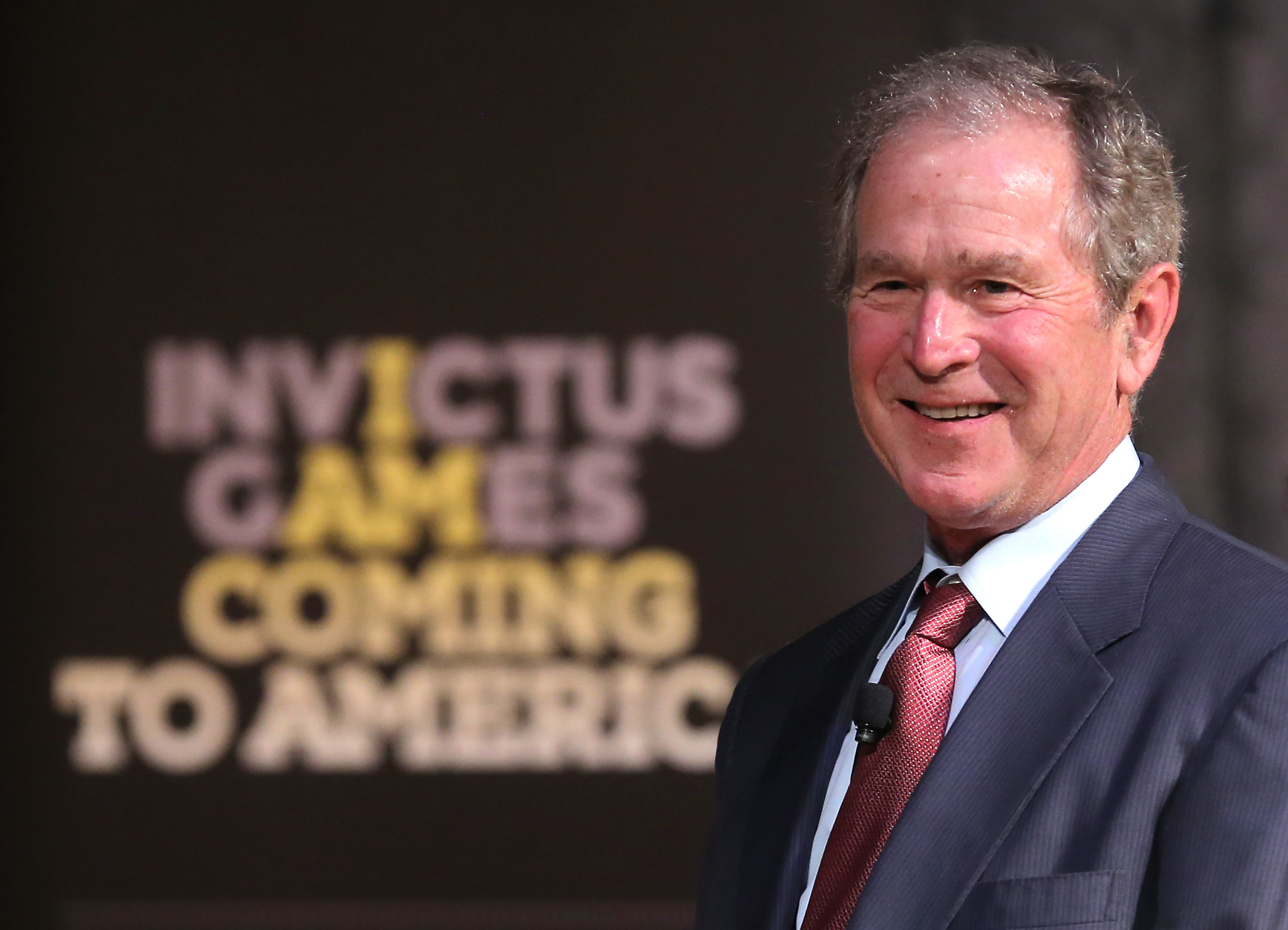 NEW YORK, NY - DECEMBER 03: Former President George W. Bush speaks to aspiring Invictus competitors during an event to announce a major initiative prior to the 2016 Invictus Games in Orlando, Florida at the Intrepid Sea-Air-Space Museum on December 3, 2015 in New York City. The announcement was to promote the initiative by the George W. Bush Institute in partnership with the Invictus Games to address the invisible wounds of war and a the role of sports in recovery. Jemal Countess/Getty Images/AFP