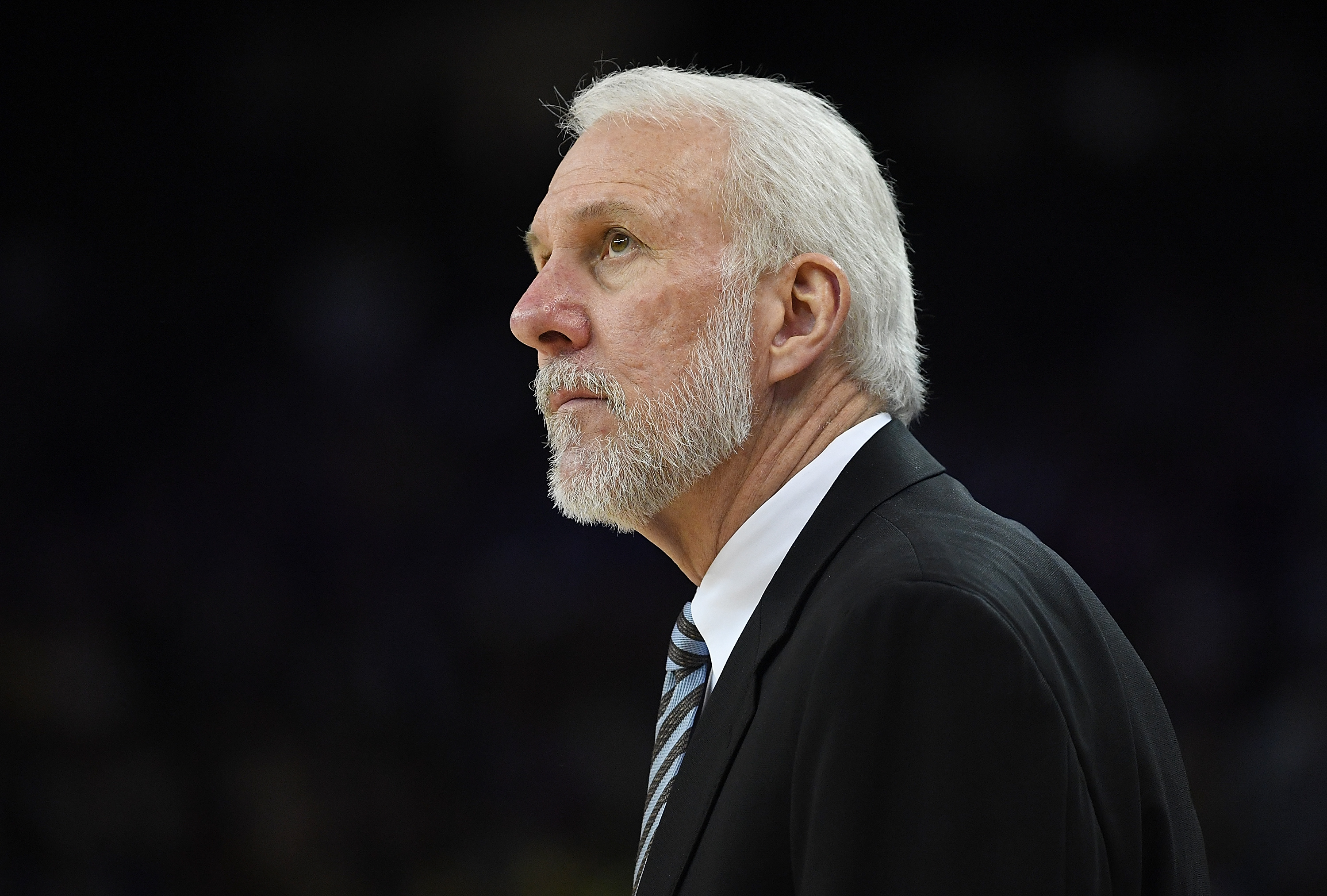 OAKLAND, CALIFORNIA - APRIL 07: Head coach Gregg Popovich of the San Antonio Spurs looks on against the Golden State Warriors in the fourth quarter of an NBA basketball game at ORACLE Arena on April 7, 2016 in Oakland, California. NOTE TO USER: User expressly acknowledges and agrees that, by downloading and or using this photograph, User is consenting to the terms and conditions of the Getty Images License Agreement.   Thearon W. Henderson/Getty Images/AFP