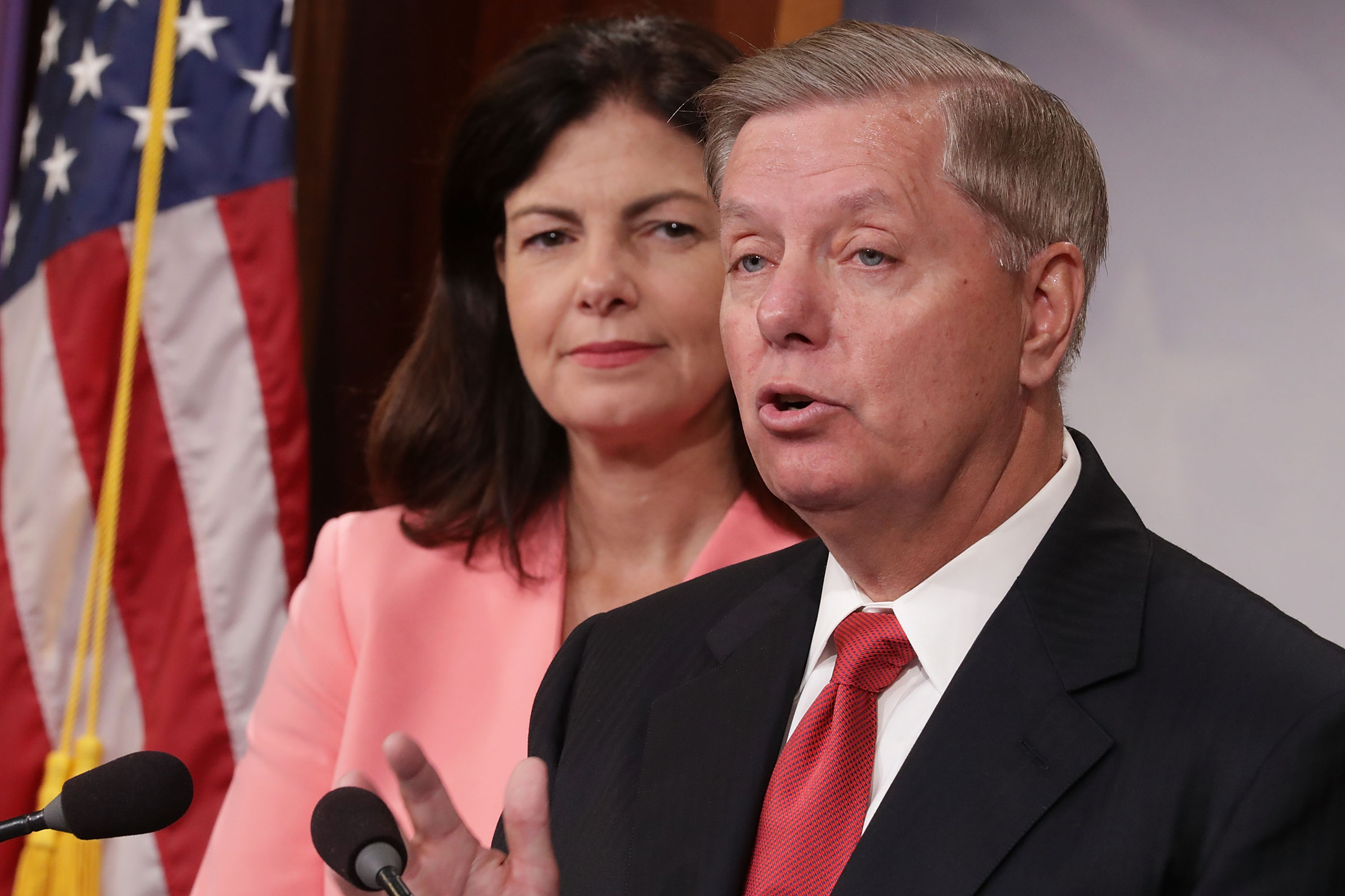 WASHINGTON, DC - SEPTEMBER 20: Sen. Kelly Ayotte (R-NH) (L) and Sen. Lindsey Graham (R-SC) hold a news conference about military assistance to Israel at the U.S. Capitol September 20, 2016 in Washington, DC. Sen. Lindsey Graham (R-SC) is threatening to stall approval of an agreement on military assistance between the U.S. and Israel by introducing legislation that would boost the aid above what the countries agreed on. Chip Somodevilla/Getty Images/AFP