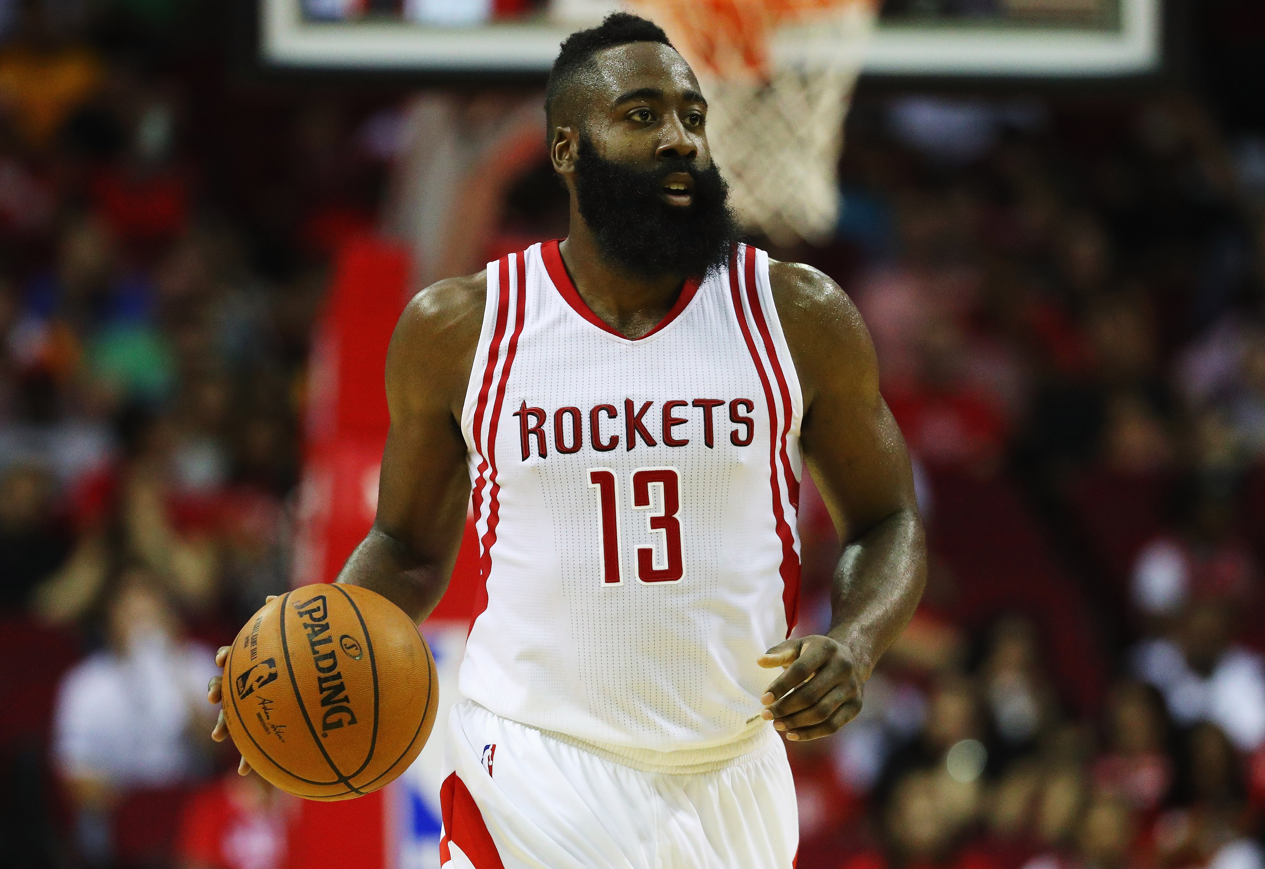 HOUSTON, TX - OCTOBER 04: James Harden #13 of the Houston Rockets in action during their game against the New York Knicks at the Toyota Center on October 4, 2016 in Houston, Texas. NOTE TO USER: User expressly acknowledges and agrees that, by downloading and or using this Photograph, user is consenting to the terms and conditions of the Getty Images License Agreement.   Scott Halleran/Getty Images/AFP