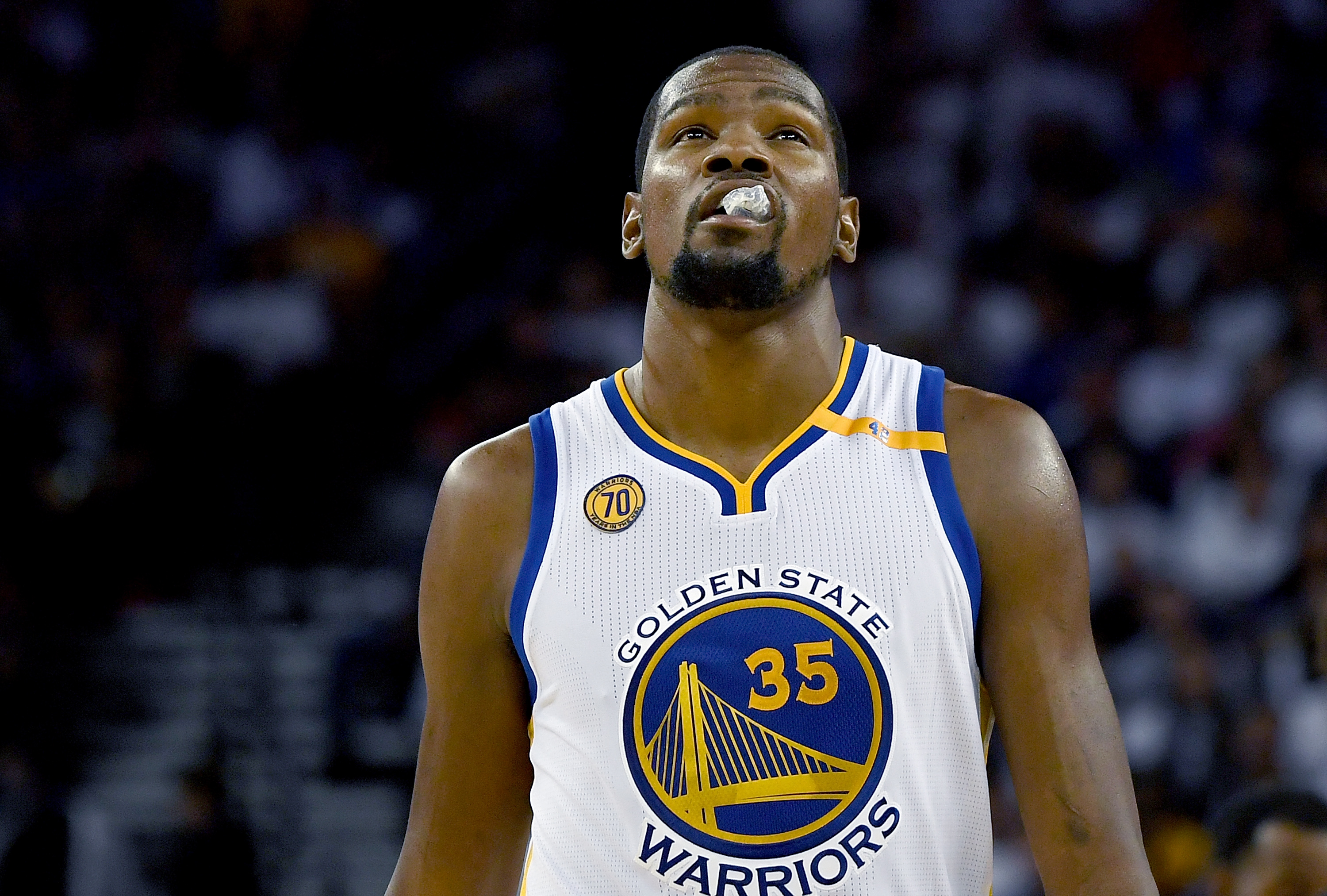 OAKLAND, CA - OCTOBER 25: Kevin Durant #35 of the Golden State Warriors looks on against the San Antonio Spurs during the third quarter in an NBA basketball game at ORACLE Arena on October 25, 2016 Oakland, California. NOTE TO USER: User expressly acknowledges and agrees that, by downloading and or using this photograph, User is consenting to the terms and conditions of the Getty Images License Agreement.   Thearon W. Henderson/Getty Images/AFP