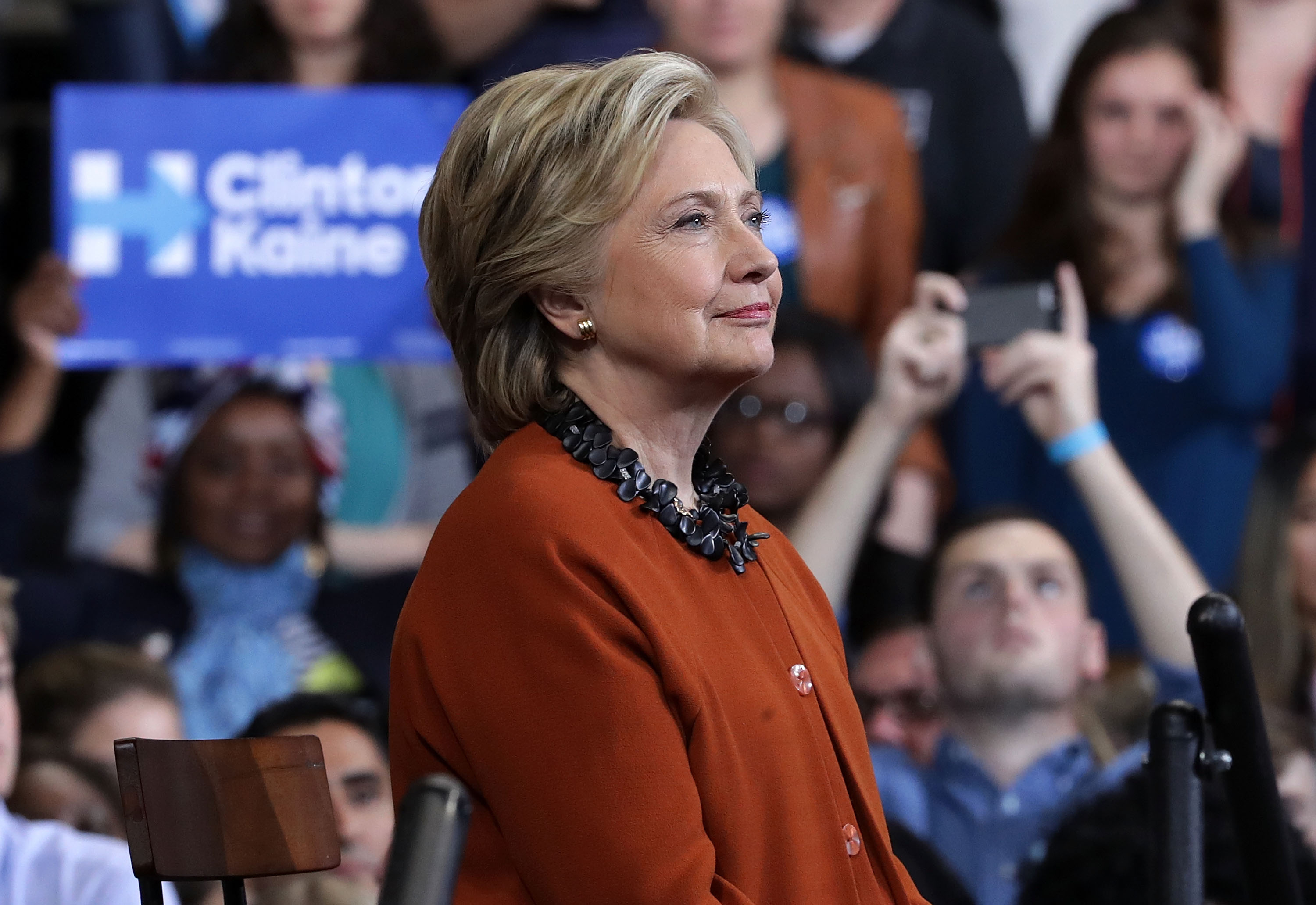 WINSTON-SALEM, NC - OCTOBER 27: Democratic presidential candidate Hillary Clinton listens during a campaign event at the Lawrence Joel Veterans Memorial Coliseum October 27, 2016 in Winston-Salem, North Carolina. U.S. first lady Michelle Obama joined Clinton for the first time to campaign for the presidential election. Alex Wong/Getty Images/AFP