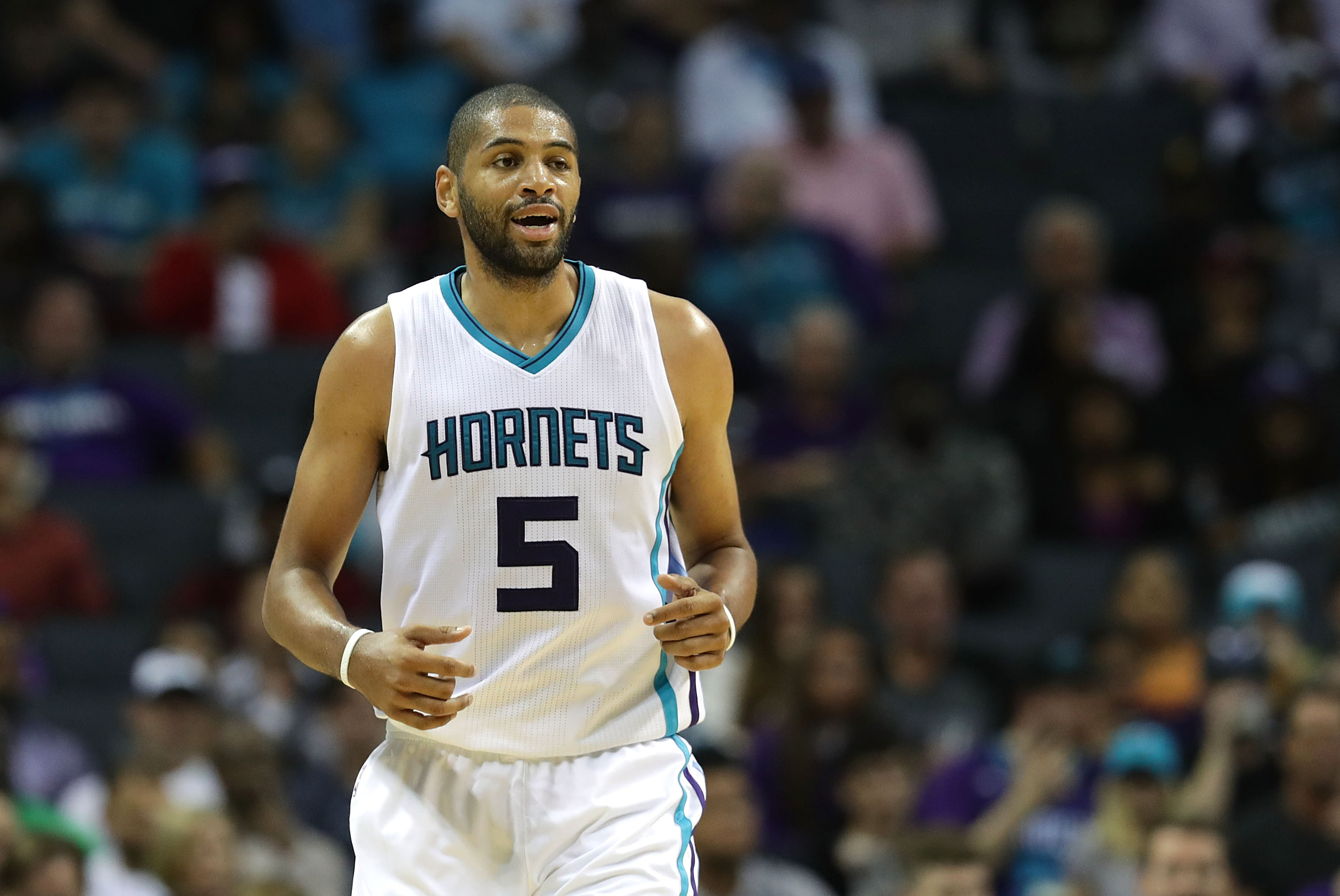 CHARLOTTE, NC - NOVEMBER 02: Nicolas Batum #5 of the Charlotte Hornets reacts after a play during their game against the Philadelphia 76ers at Spectrum Center on November 2, 2016 in Charlotte, North Carolina. NOTE TO USER: User expressly acknowledges and agrees that, by downloading and or using this photograph, User is consenting to the terms and conditions of the Getty Images License Agreement.   Streeter Lecka/Getty Images/AFP