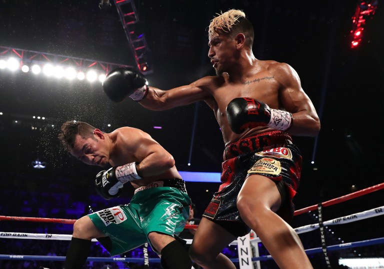 LAS VEGAS, NV - NOVEMBER 05: (R-L) Jessie Magdaleno lands a right to the head of Nonito Donaire of the Philippines during their WBO junior featherweight championship fight at the Thomas & Mack Center on November 5, 2016 in Las Vegas, Nevada. Christian Petersen/Getty Images/AFP