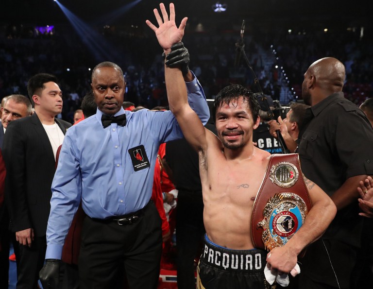 LAS VEGAS, NV - NOVEMBER 05: Manny Pacquiao of the Philippines poses after his unanimous-decision victory over Jessie Vargas at the Thomas & Mack Center on November 5, 2016 in Las Vegas, Nevada. Pacquiao won the WBO welterweight championship.   Christian Petersen/Getty Images/AFP