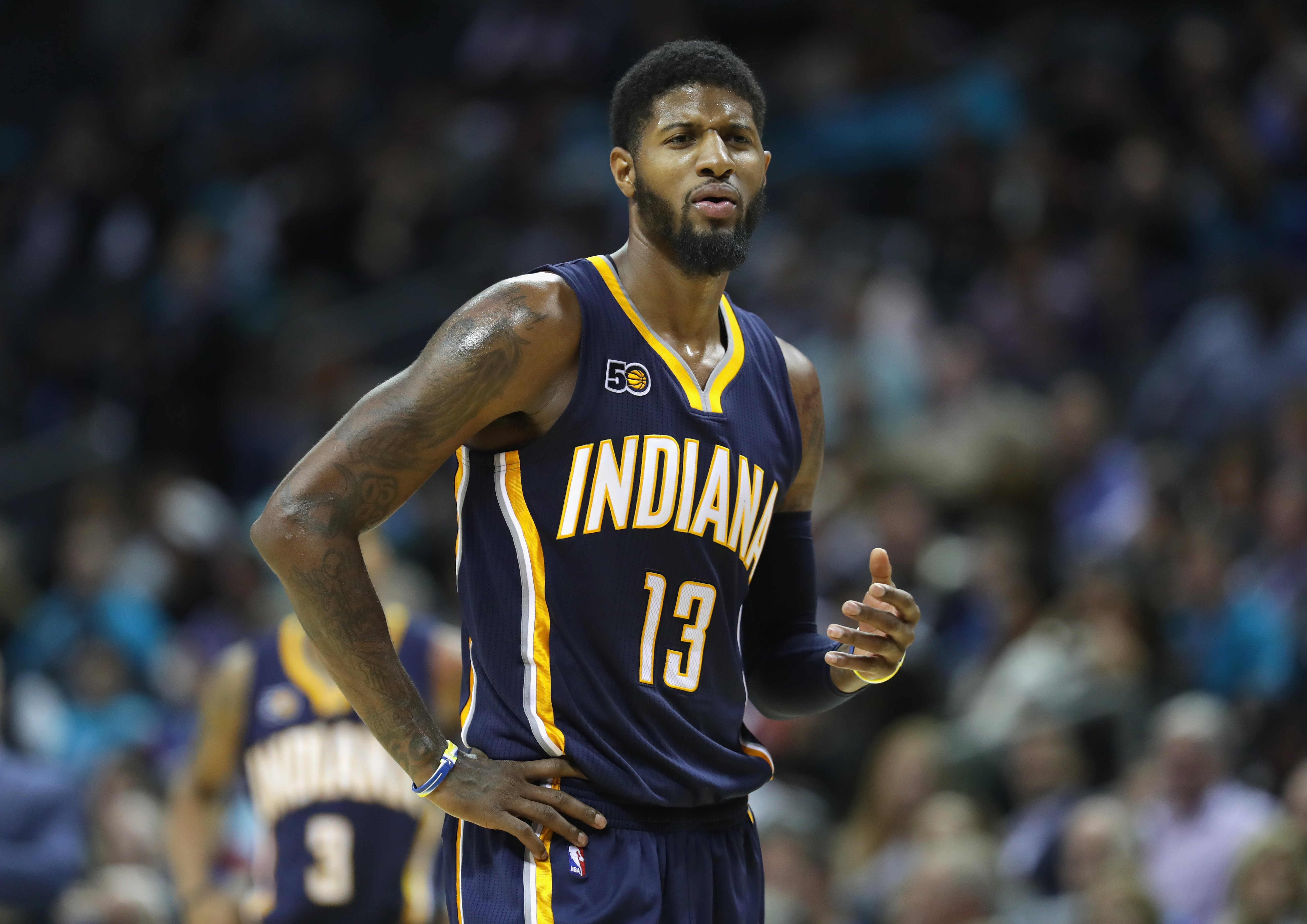 CHARLOTTE, NC - NOVEMBER 07: Paul George #13 of the Indiana Pacers reacts to a call during their game against the Charlotte Hornets at Spectrum Center on November 7, 2016 in Charlotte, North Carolina. NOTE TO USER: User expressly acknowledges and agrees that, by downloading and or using this photograph, User is consenting to the terms and conditions of the Getty Images License Agreement.   Streeter Lecka/Getty Images/AFP