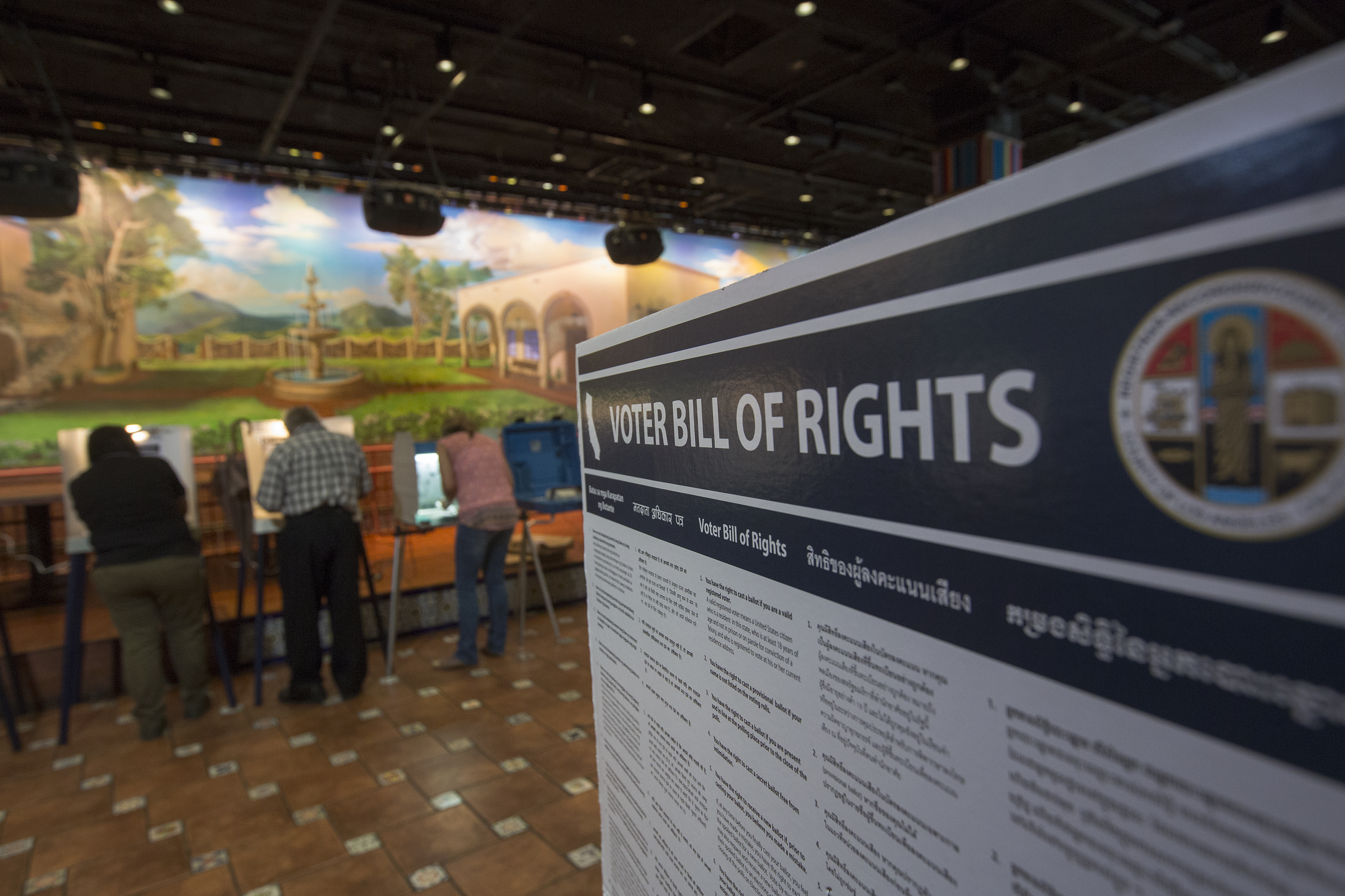 LOS ANGELES, CA - NOVEMBER 08: Latinos vote at a polling station in El Gallo Restaurant on November 8, 2016 in the Boyle Heights section of Los Angeles, California. In addition to choosing between Republican Donald Trump or Democrat Hillary Clinton for President of the United States, Californians are deciding on 17 ballot propositions. David McNew/Getty Images/AFP