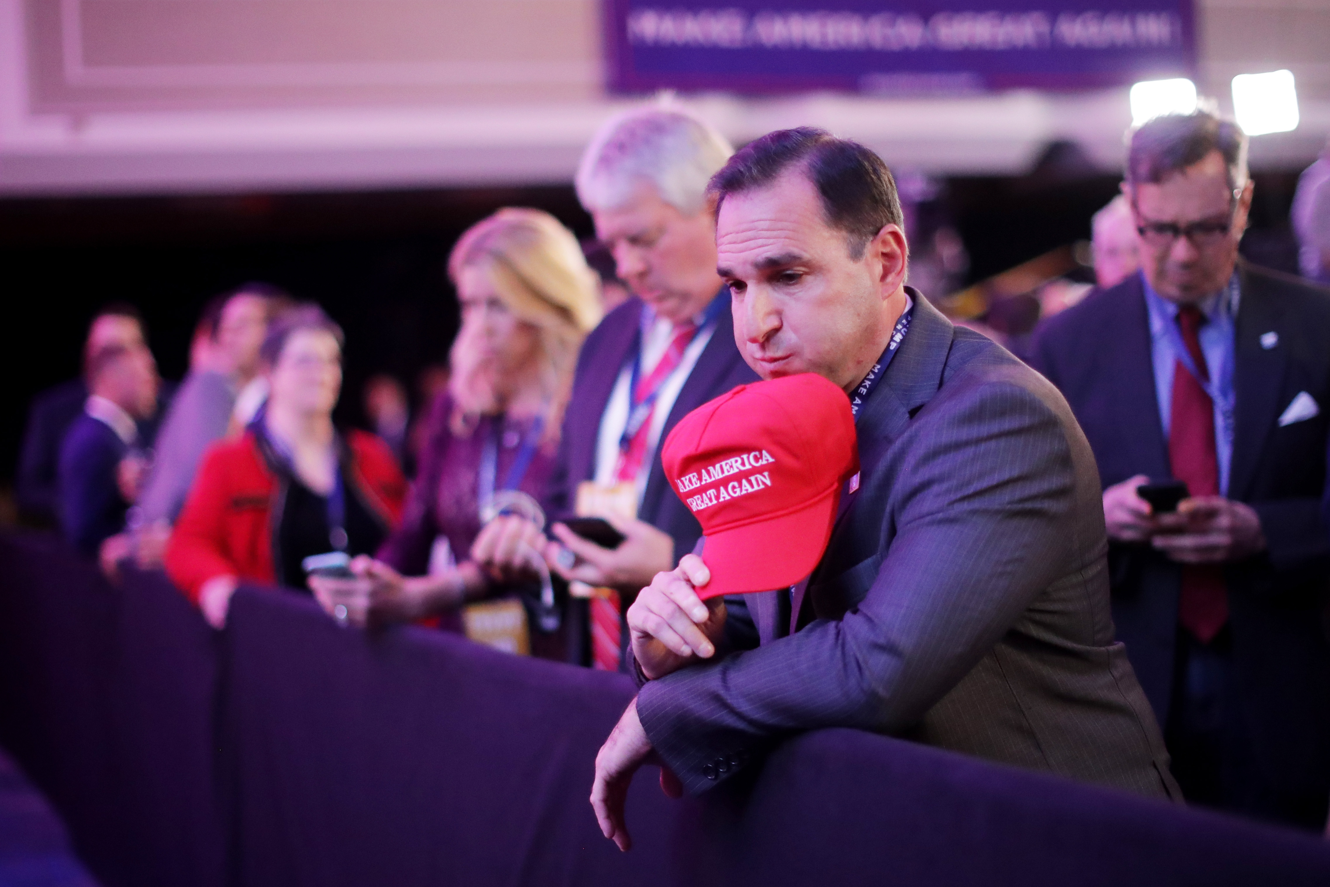 NEW YORK, NY - NOVEMBER 08: A supporter of Republican presidential nominee Donald Trump watches early results during the election night event at the New York Hilton Midtown on November 8, 2016 in New York City. Americans today will choose between Republican presidential nominee Donald Trump and Democratic presidential nominee Hillary Clinton as they go to the polls to vote for the next president of the United States. Chip Somodevilla/Getty Images/AFP