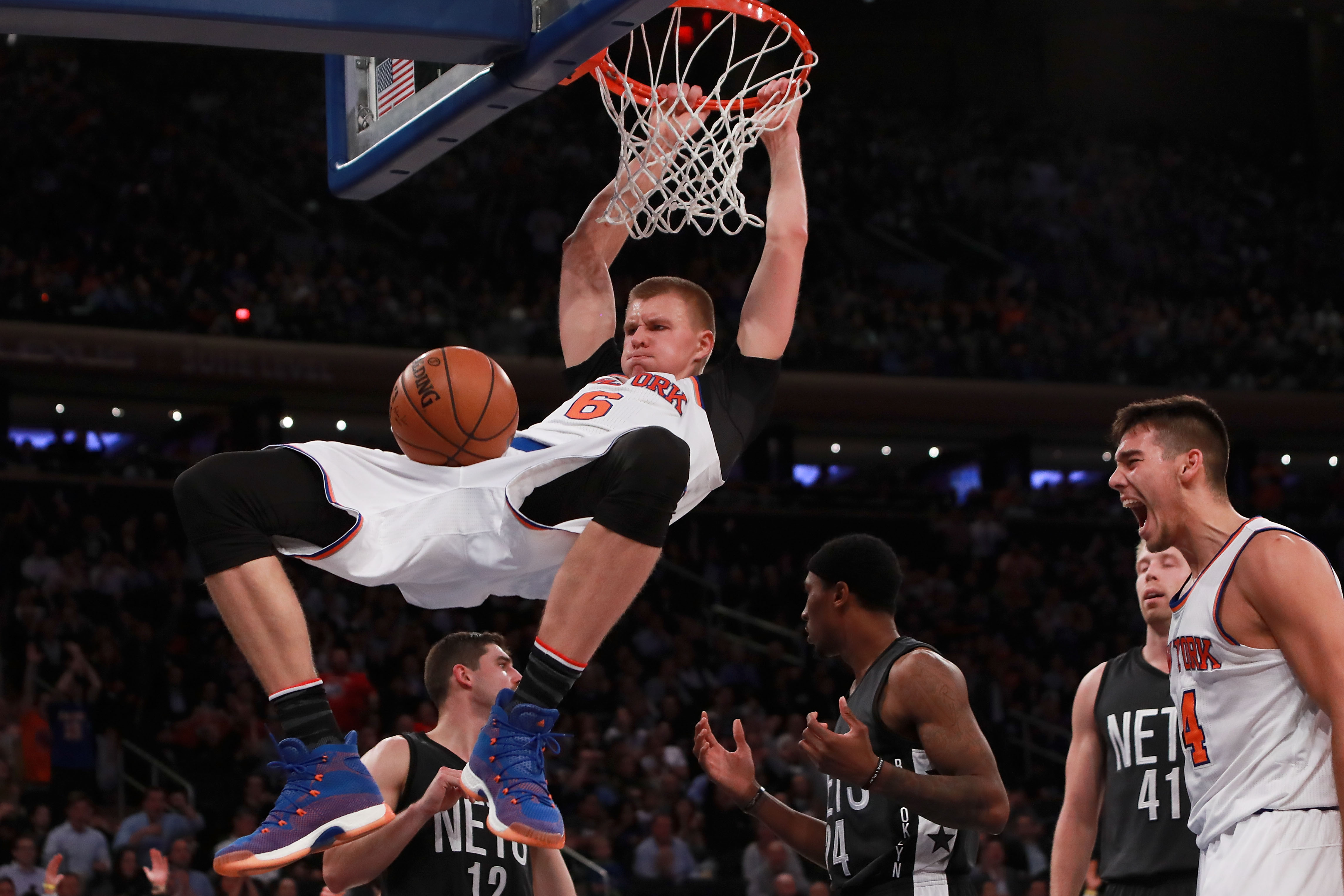 NEW YORK, NY - NOVEMBER 09: Kristaps Porzingis #6 of the New York Knicks dunks against the Brooklyn Nets during the second half at Madison Square Garden on November 9, 2016 in New York City. NOTE TO USER: User expressly acknowledges and agrees that, by downloading and or using this photograph, User is consenting to the terms and conditions of the Getty Images License Agreement.   Michael Reaves/Getty Images/AFP
