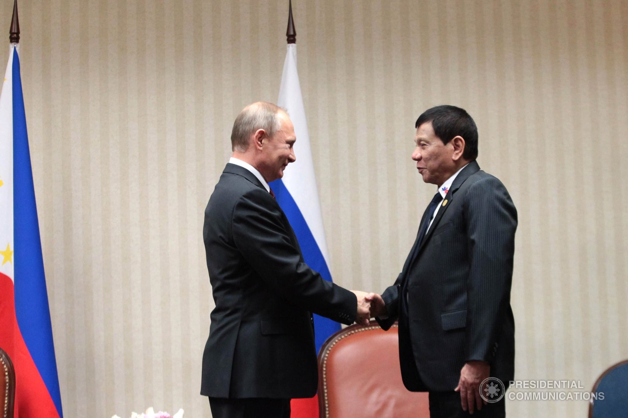 Russian Federation President Vladimir Putin is seen in this photo smiling as he and Philippine President Rodrigo Duterte shake hands during their bilateral meeting at the sidelines of the APEC Leaders' Summit in Lima, Peru. (Presidential Communications photo)