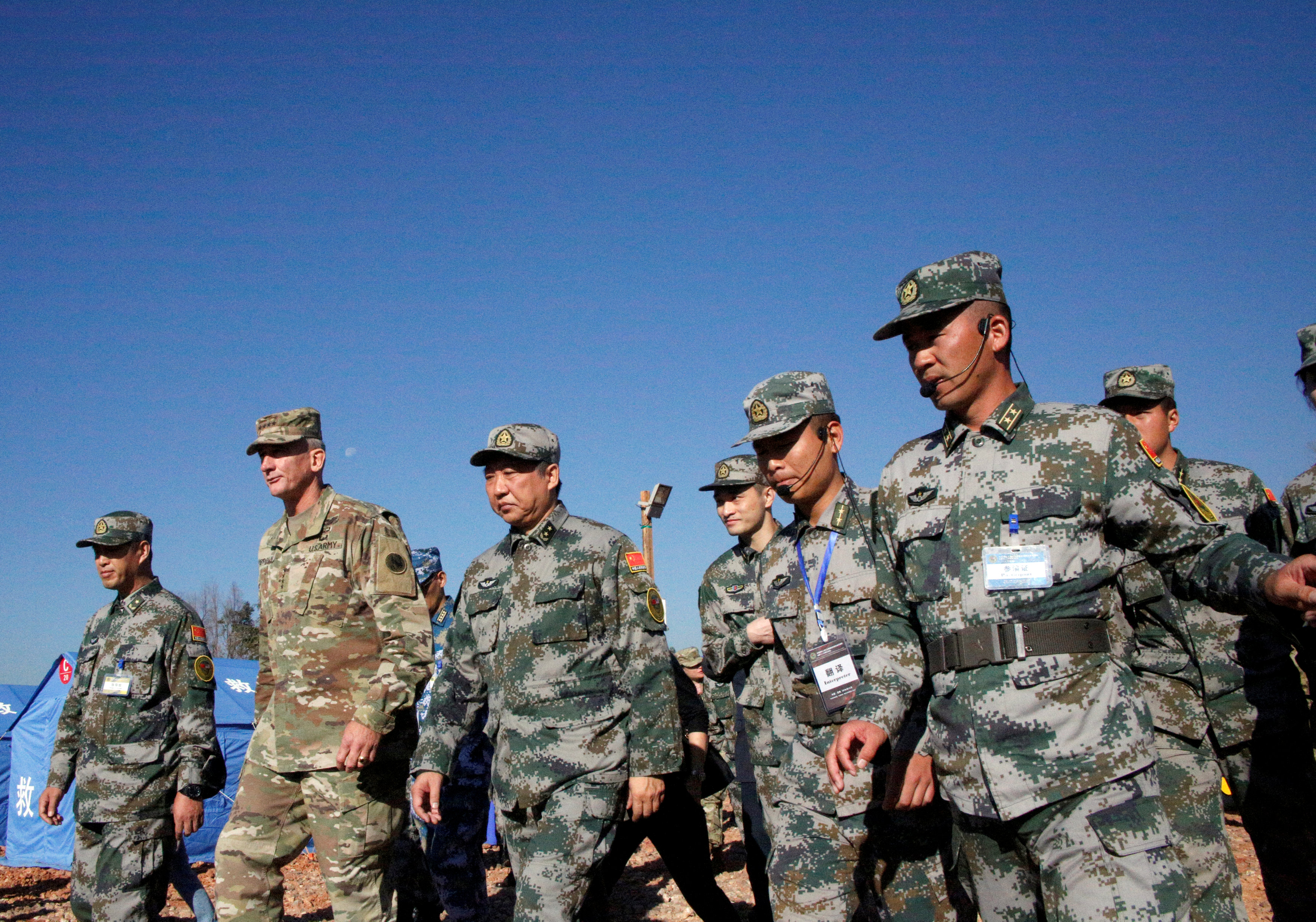 Liu Xiaowu (C), army commander of the Chinese southern military region, and General Robert Brown (2nd L), commanding general of the U.S. Army Pacific, attend a session as the Chinese and U.S. armed forces hold joint humanitarian relief drills in Kunming, Yunnan province, China November 18, 2016. REUTERS/Natalie Thomas