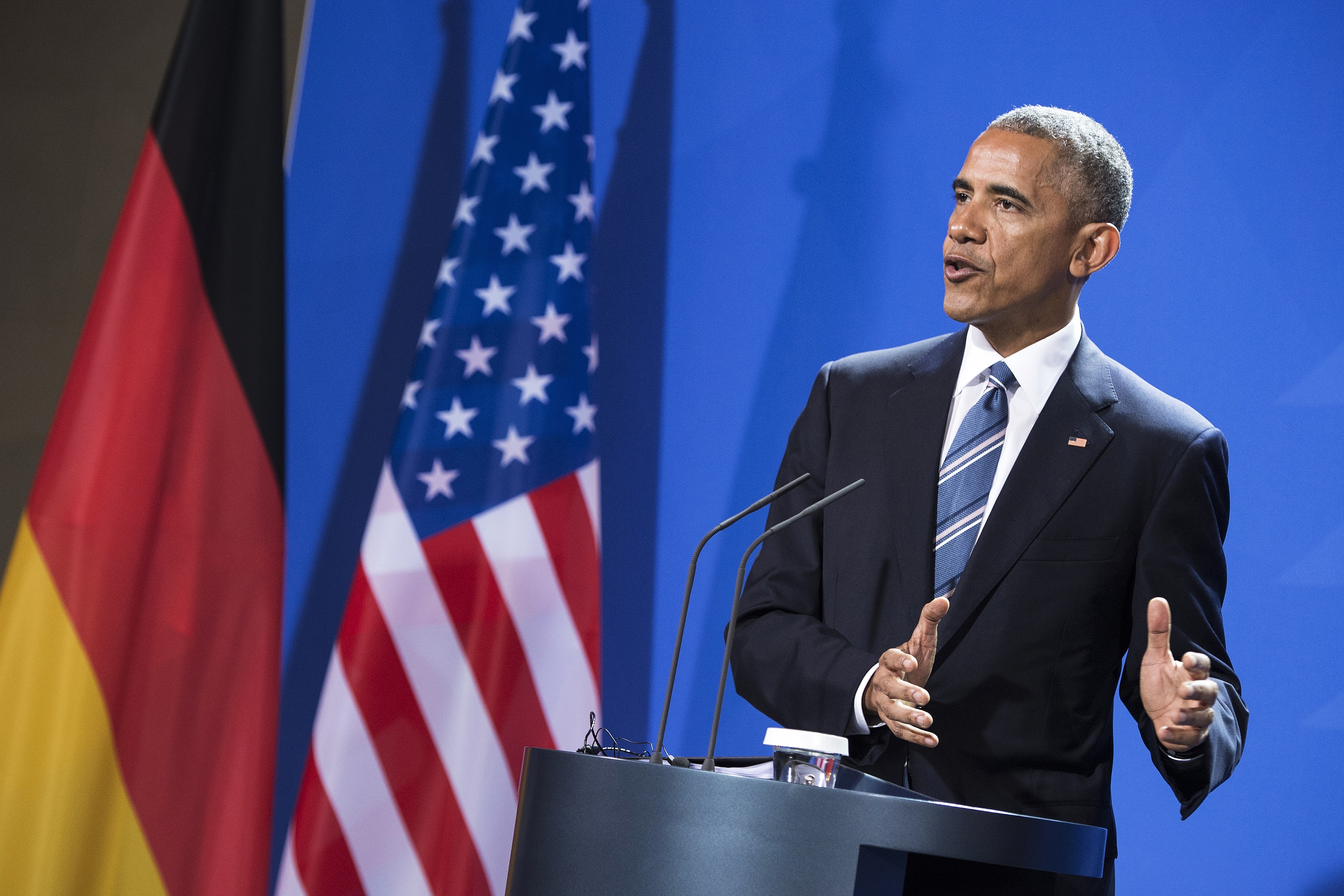 US President Barack Obama addresses a press conference with the German Chancellor after their meeting at the chancellery in Berlin on November 17, 2016. US President Barack Obama pays a farewell visit to German Chancellor Angela Merkel, seen by some as the new standard bearer of liberal democracy since the election of Donald Trump. / AFP PHOTO / Brendan Smialowski