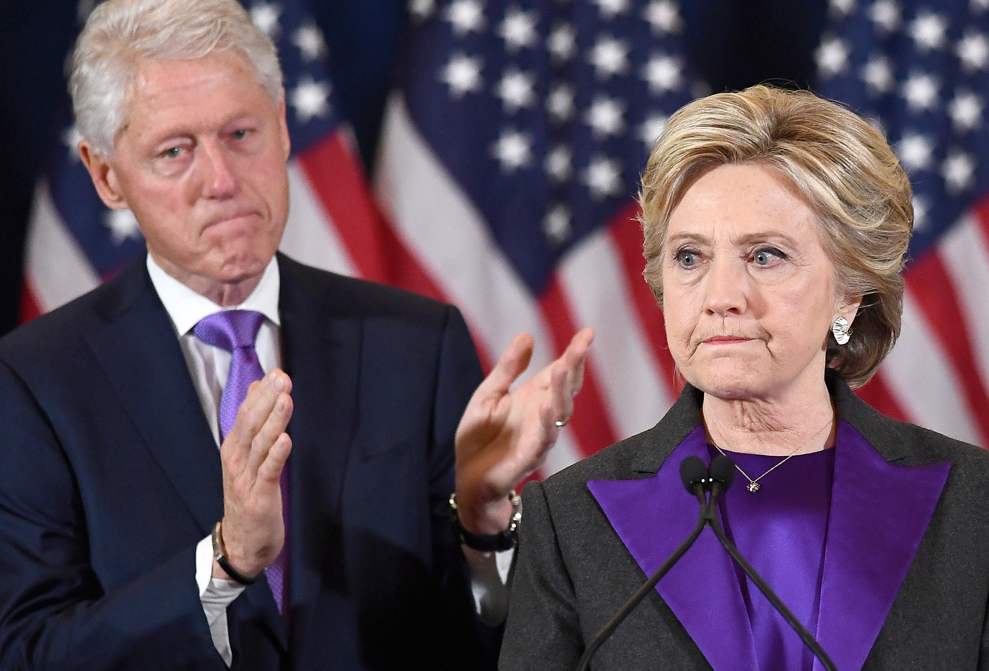 US Democratic presidential candidate Hillary Clinton makes a concession speech after being defeated by Republican President-elect Donald Trump, as former President Bill Clinton looks on in New York on November 9, 2016. / AFP PHOTO / JEWEL SAMAD