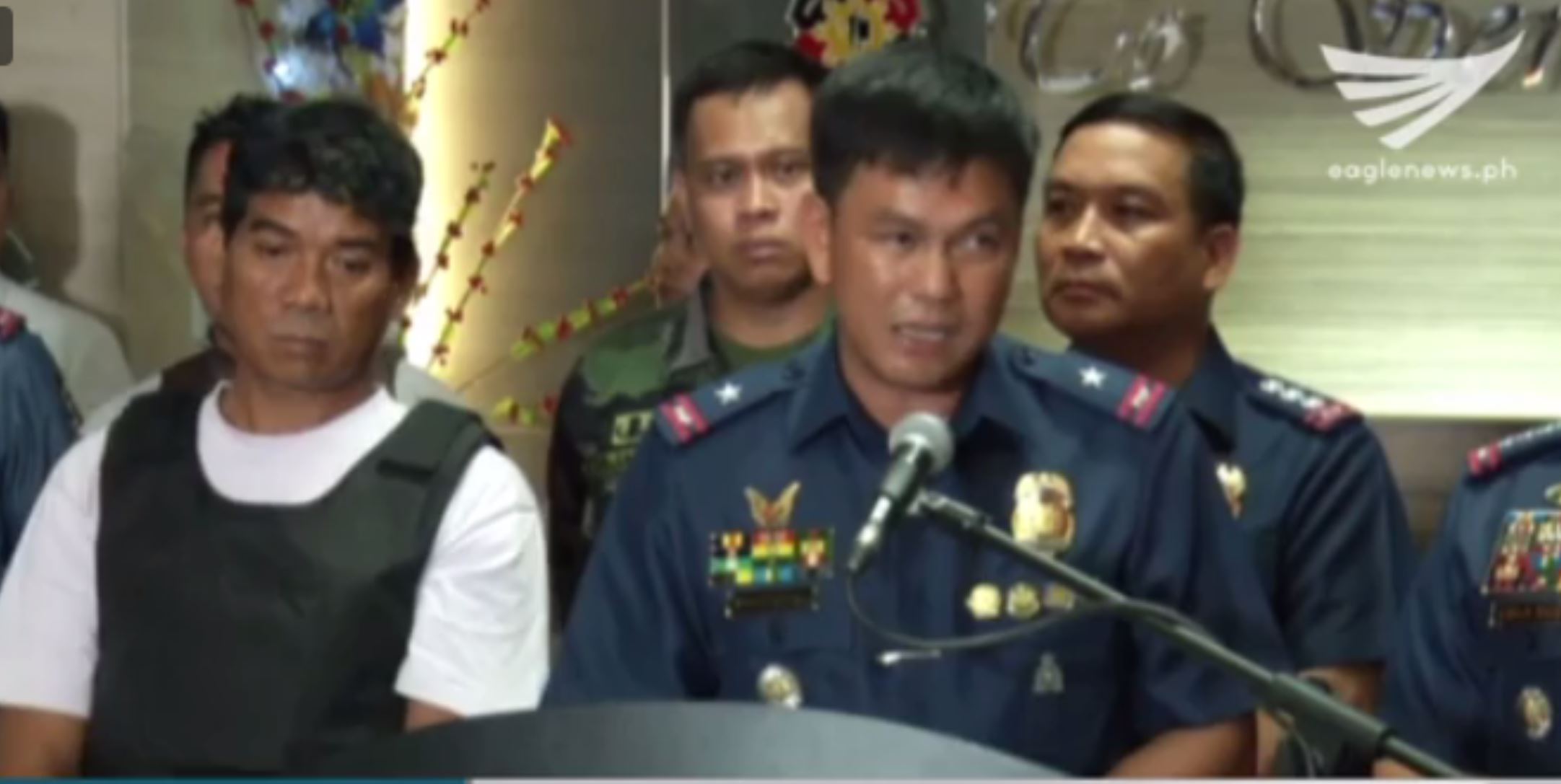 Ronnie Dayan looking forlorn as a police operative explained to the media how he was caught. (Eagle News Service)