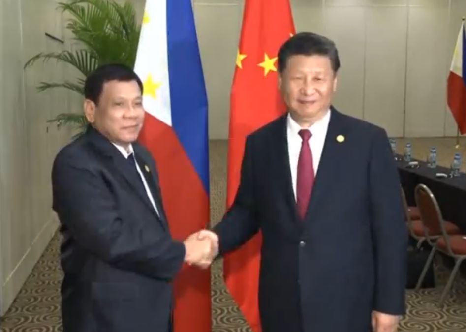 Chinese President Xi Jinping shaking hands with Philippine President Rodrigo Duterte during their meeting at the sidelines of the APEC Leaders' Summit in Lima, Peru. (Photo grabbed from CCTV video)
