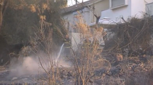 Fire fighter extiguishing fire in the woods. (Photo courtesy of Reuters video file)