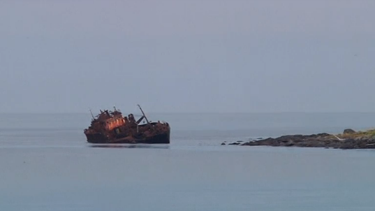 A ship-wreck in the nearby cliff. (Photo courtesy of Reuters video clip)