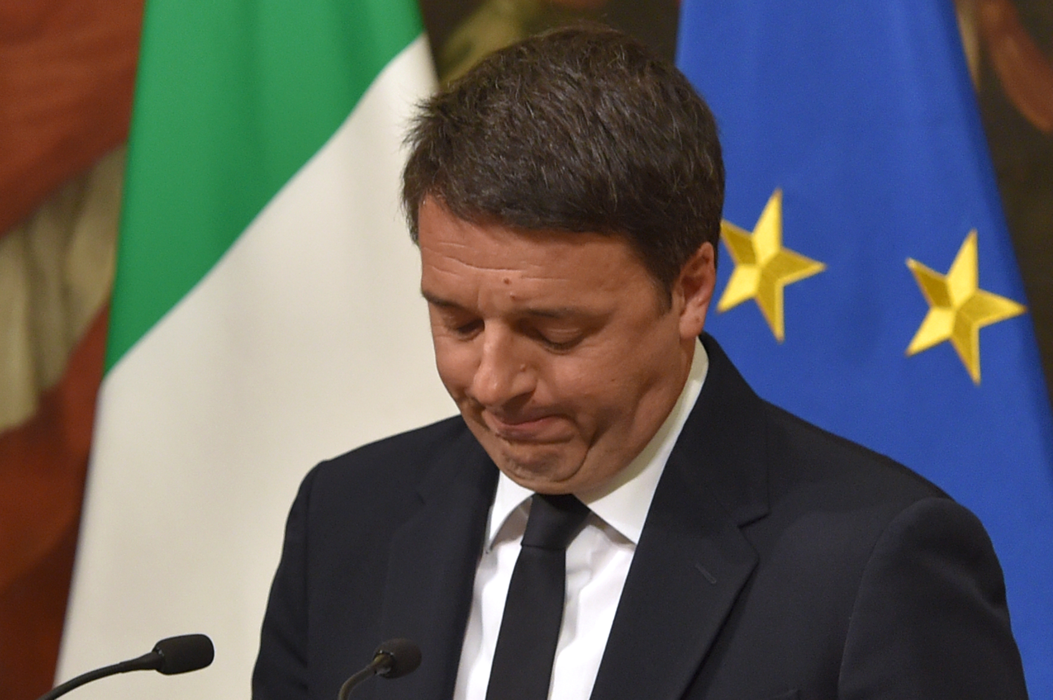 Italy's Prime Minister Matteo Renzi announces his resignation during a press conference at the Palazzo Chigi following the results of the vote for a referendum on constitutional reforms, on December 5, 2016 in Rome. "My experience of government finishes here," Renzi told a press conference after the No campaign won what he described as an "extraordinarily clear" victory in the referendum on which he had staked his future.  / AFP PHOTO / Andreas SOLARO / The erroneous mention[s] appearing in the metadata of this photo by Andreas SOLARO has been modified in AFP systems in the following manner: [December 5, 2016] instead of [December 4, 2016]. Please immediately remove the erroneous mention[s] from all your online services and delete it (them) from your servers. If you have been authorized by AFP to distribute it (them) to third parties, please ensure that the same actions are carried out by them. Failure to promptly comply with these instructions will entail liability on your part for any continued or post notification usage. Therefore we thank you very much for all your attention and prompt action. We are sorry for the inconvenience this notification may cause and remain at your disposal for any further information you may require.