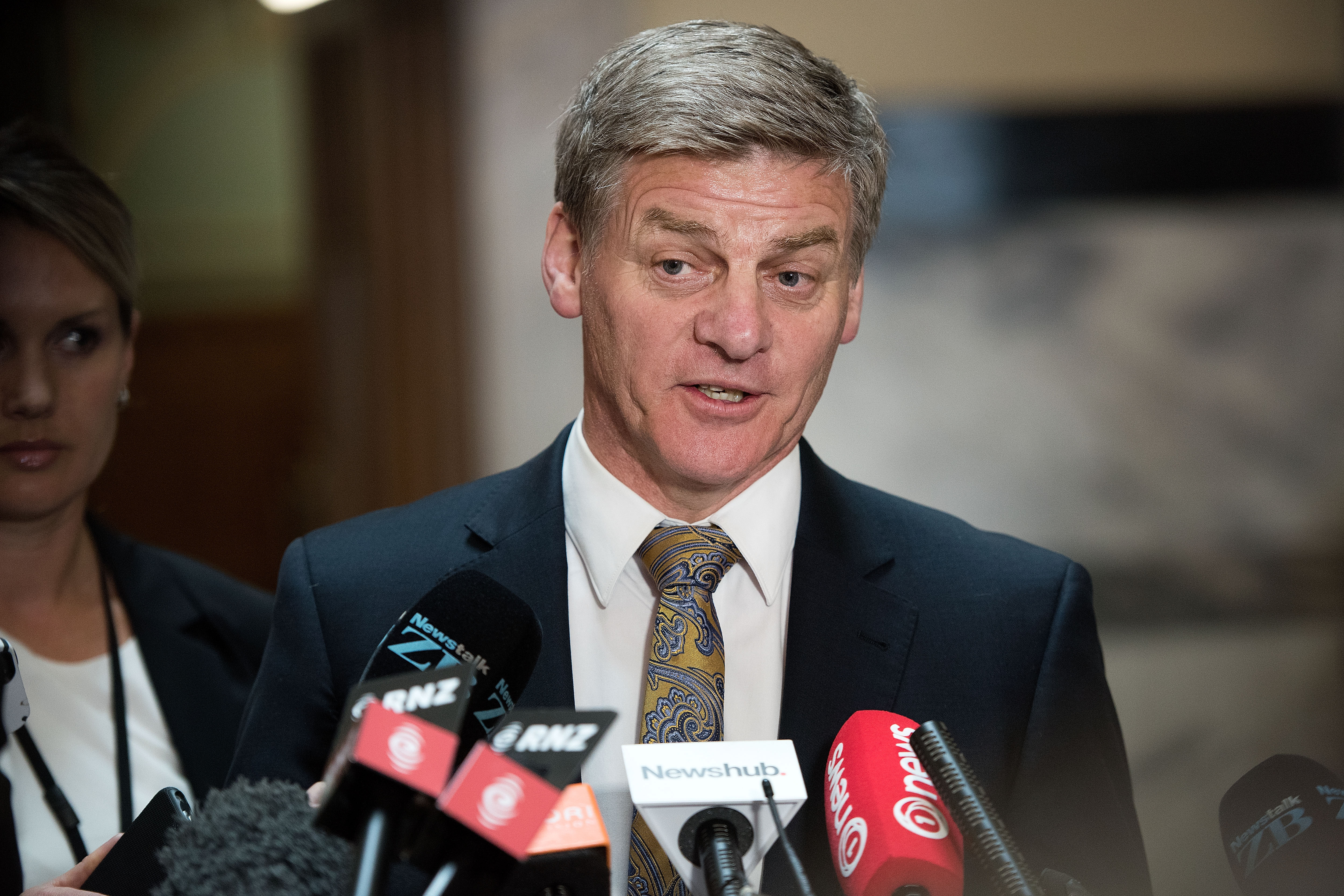 New Zealand Deputy Prime Minister Bill English speaks to the media during a press conference at Parliament in Wellington on December 5, 2016. Prime Minister of New Zealand John Key announced his resignation that will take effect from December 12. English has been put forward by Key as his replacement. / AFP PHOTO / Marty Melville