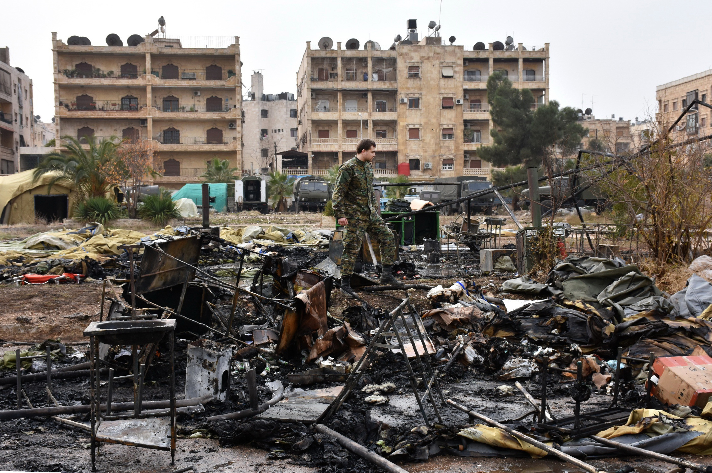 A Russian soldier inspects the damage at a field hospital that was reportedly destroyed by rebel shelling on December 5, 2016 in the Furqan neighbourhood of the government-held side of west Aleppo. A Russian army medic was killed Monday and two others seriously injured in rebel shelling of a field hospital in Syria's Aleppo, Russia's defence ministry said, blaming Western nations who support rebel fighters. / AFP PHOTO / GEORGE OURFALIAN