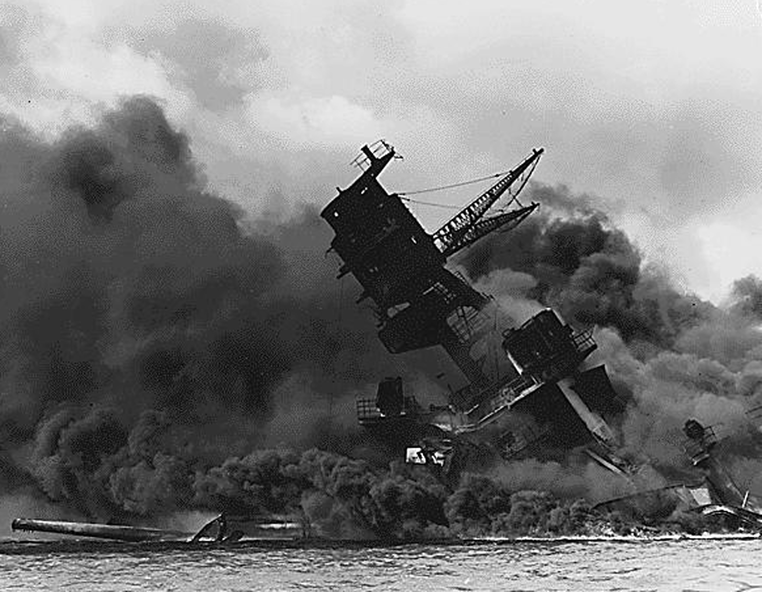 (FILES) This US Navy file image shows The USS Arizona afire and sinking after the Japanese attack on Pearl Harbor on December 7, 1941. The Arizona went down entombing 1,177 crewmembers. Seventy-five years after Japan's surprise attack on Pearl Harbor killed 2,403 Americans, a group of forensic scientists in Hawaii is still working to identify the remains of the dead. A jumble of skulls, bones and teeth deemed unidentifiable in the years following the devastating attack are now being linked to missing sailors and Marines, thanks to advances in DNA testing. / AFP PHOTO / US NAVY / HO / RESTRICTED TO EDITORIAL USE - MANDATORY CREDIT AFP PHOTO /US NAVY - NO MARKETING - NO ADVERTISING CAMPAIGNS - DISTRIBUTED AS A SERVICE TO CLIENTS