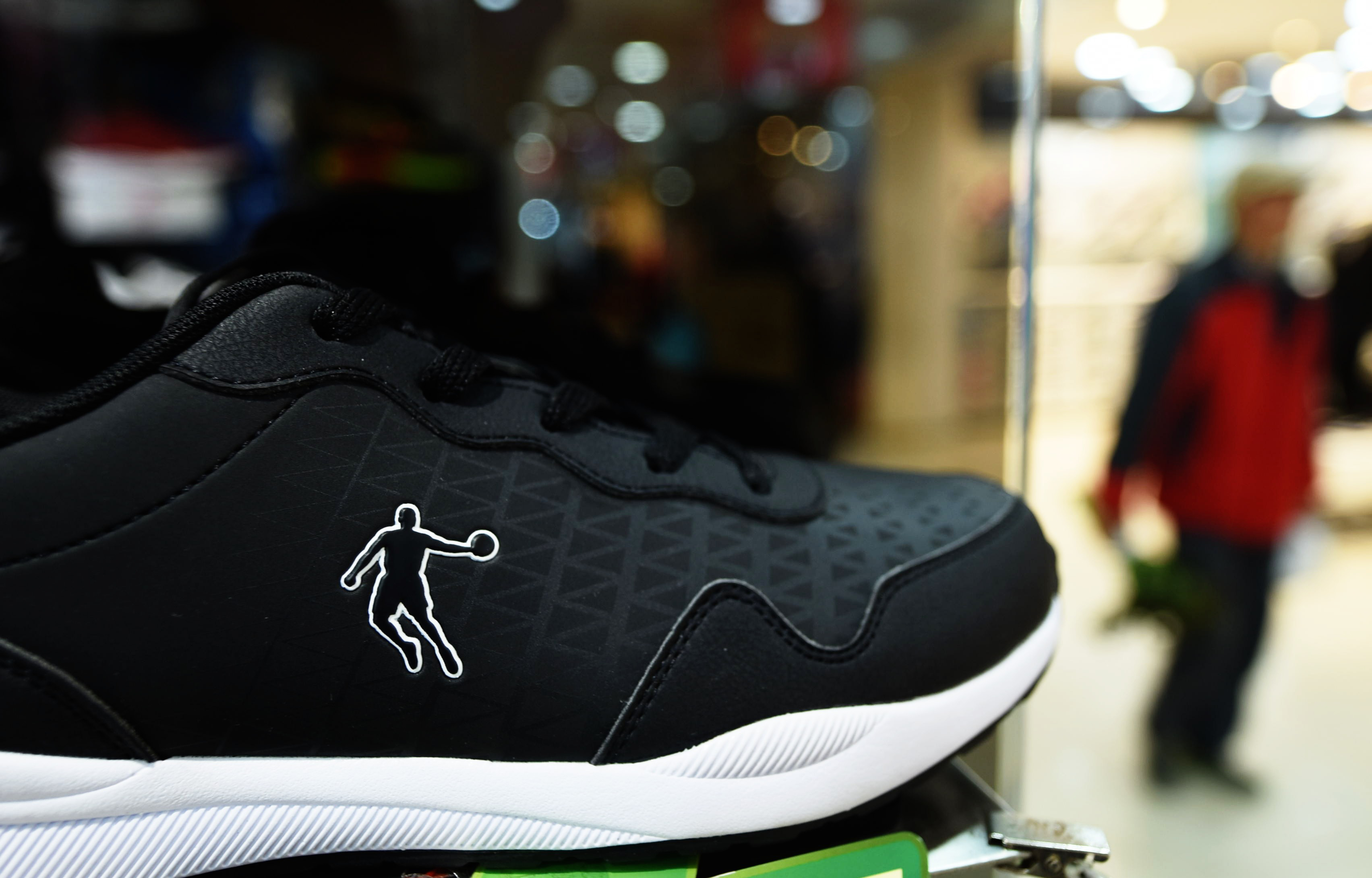 A Qiaodan brand shoe is displayed at a Qiaodan store in Hangzhou in China's Zhejiang province on December 8, 2016.  Basketball mega-star Michael Jordan won part of his trademark suit against a China-based sportswear company December 8, following a years-long struggle for control over the rights to his Chinese name. In a ruling by the Chinese Supreme Court, Qiaodan Sports Co,  based in southeastern Fujian province, must stop using the Chinese characters "Qiaodan" on its merchandise, according to a transcript of court records posted on an official website.  / AFP PHOTO / STR / China OUT