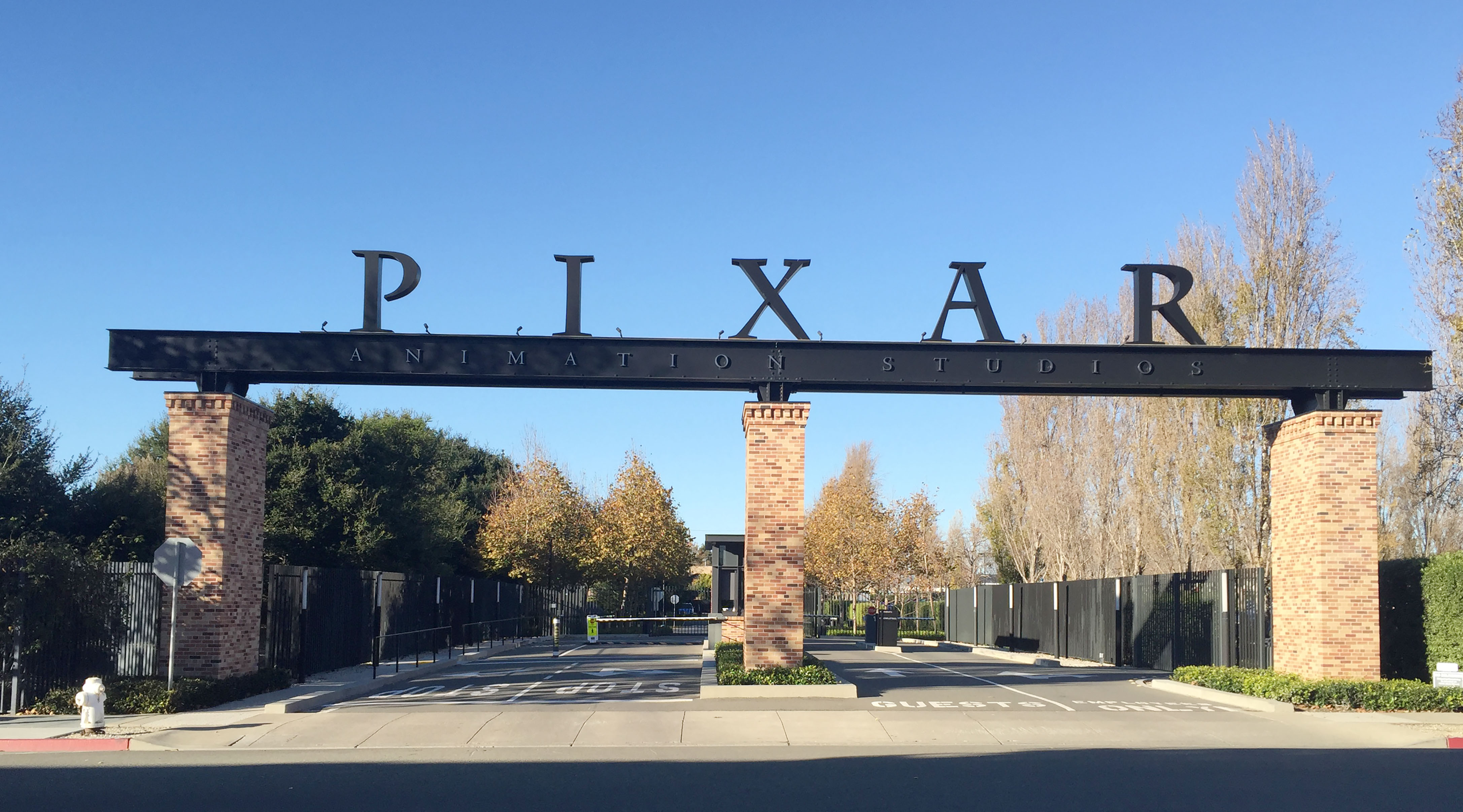The gates to Pixar's campus is seen in Emeryville, California, on November 29, 2016. Over 21 years of unparalleled success, the executives at animation studio Pixar have developed an aphorism they are fond of repeating -- that their movies are never finished, just released. The motto speaks to the perfectionism that has seen the company gross almost $11 billion and win 13 Oscars since "Toy Story" blazed a trail as the world's first feature-length computer-generated animation in 1995.  / AFP PHOTO / Frankie TAGGART / TO GO WITH AFP STORY BY FRANKIE TAGGART-"Pixar celebrates 21 years with 'love letter' to Mexico"