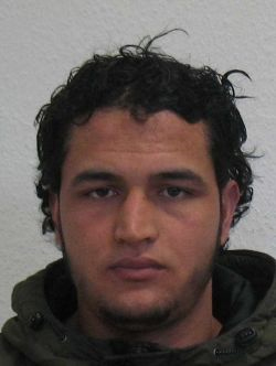 This handout portrait released by German Federal Police Office (BKA) on December 21, 2016 shows a Tunisian man identified as Anis Amri, suspected of being involved in the Berlin Christmas market attack, that killed 12 people on December 19. German police on December 21, 2016 launched a manhunt and requested an European arrest warrant for Anis Amri, a rejected asylum seeker suspected of involvement in a deadly truck assault on a Berlin Christmas market claimed by the Islamic State jihadist group. / AFP PHOTO / BKA / HO / RESTRICTED TO EDITORIAL USE - MANDATORY CREDIT "AFP PHOTO / BKA / HANDOUT" - NO MARKETING NO ADVERTISING CAMPAIGNS - DISTRIBUTED AS A SERVICE TO CLIENTS