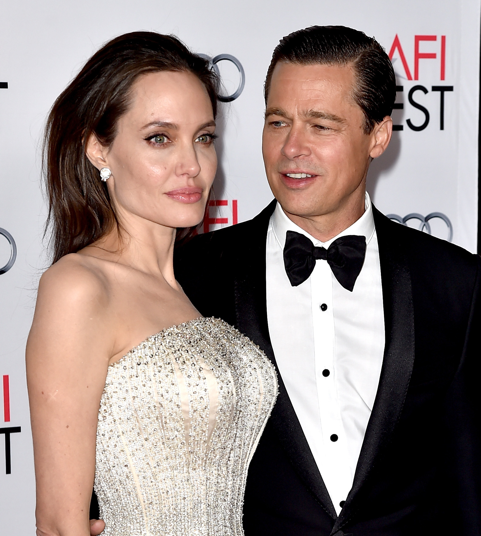 (FILES) This file photo taken on November 04, 2015 shows actress Angelina Jolie Pitt and husband actor Brad Pitt at the AFI FEST 2015 presented by Audi opening night gala premiere of Universal Pictures' "By The Sea" at the Chinese Theatre in Los Angeles, California. Brad Pitt has accused Angelina Jolie of compromising their children's privacy and is asking a judge to seal details about the youngsters emerging from the couple's divorce, court papers showed Thursday. / AFP PHOTO / KEVIN WINTER