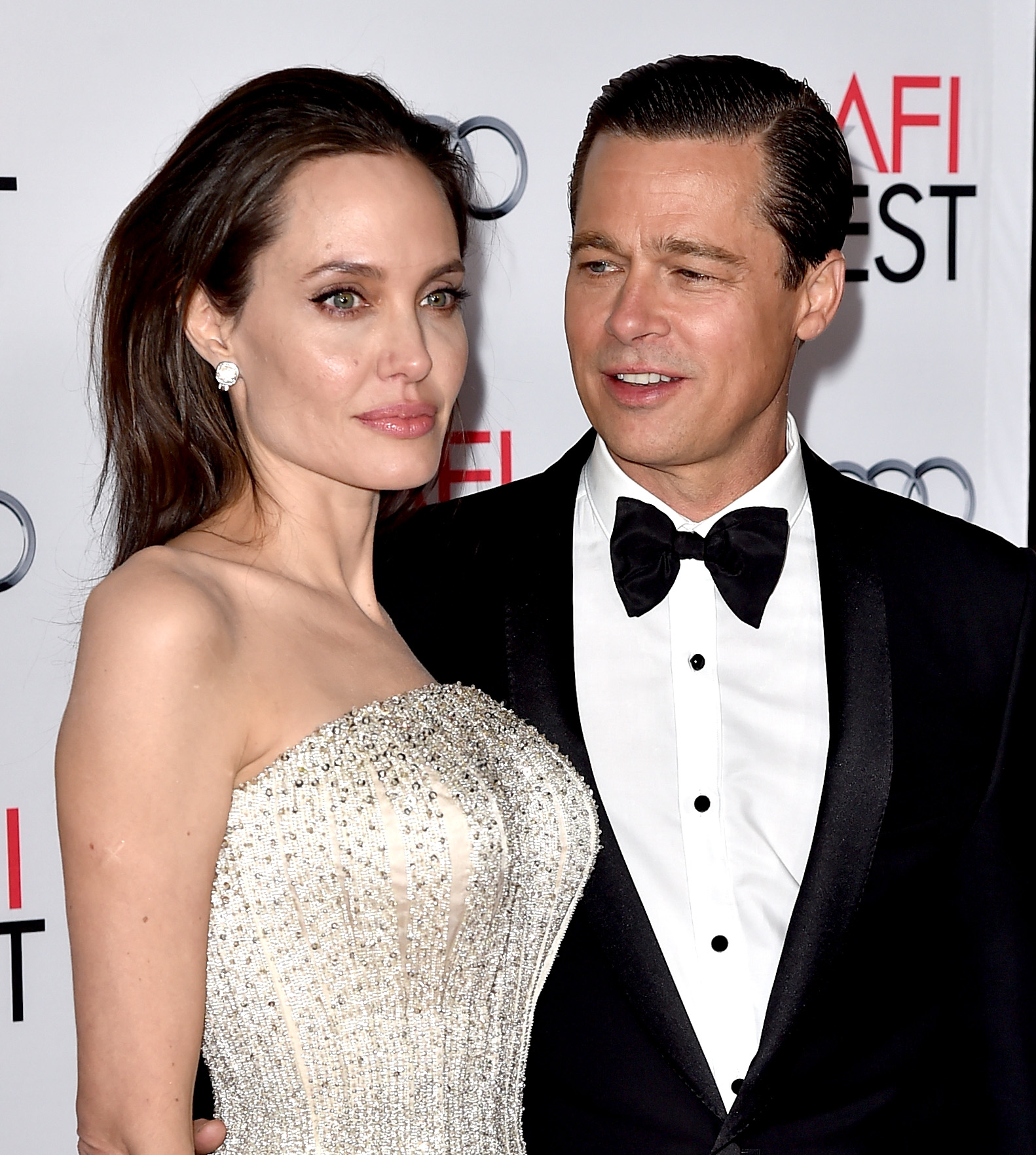 (FILES) This file photo taken on November 04, 2015 shows actress Angelina Jolie Pitt and husband actor Brad Pitt at the AFI FEST 2015 presented by Audi opening night gala premiere of Universal Pictures' "By The Sea" at the Chinese Theatre in Los Angeles, California. Brad Pitt has accused Angelina Jolie of compromising their children's privacy and is asking a judge to seal details about the youngsters emerging from the couple's divorce, court papers showed Thursday. / AFP PHOTO / KEVIN WINTER