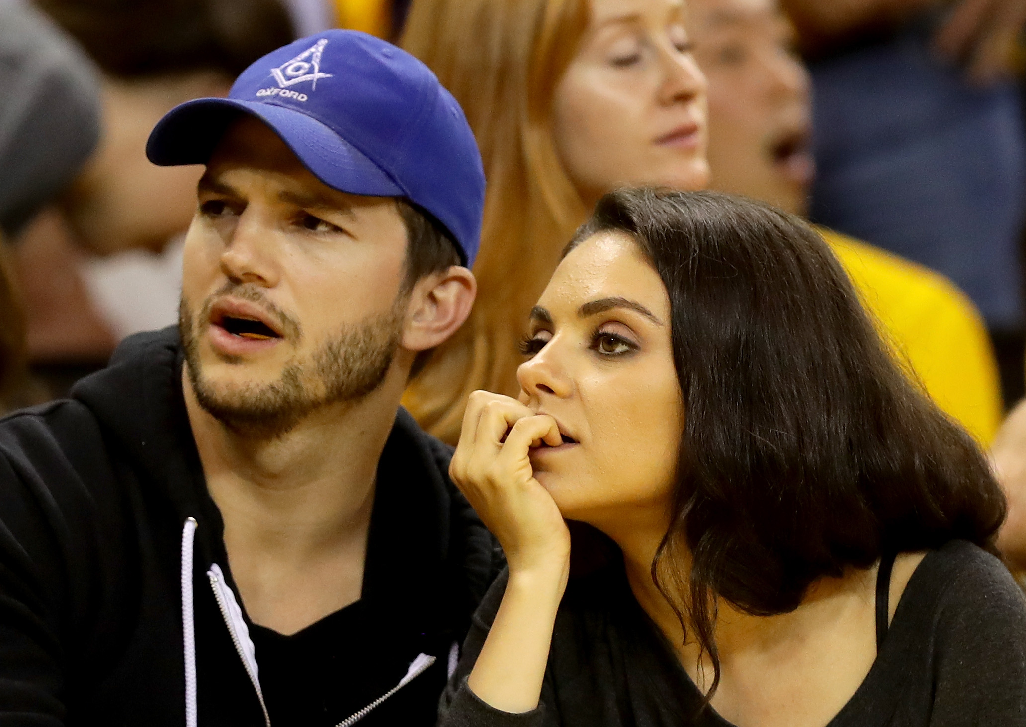 OAKLAND, CA - JUNE 05: (L-R) Actors Ashton Kutcher and Mila Kunis attend Game 2 of the 2016 NBA Finals between the Golden State Warriors and the Cleveland Cavaliers at ORACLE Arena on June 5, 2016 in Oakland, California. NOTE TO USER: User expressly acknowledges and agrees that, by downloading and or using this photograph, User is consenting to the terms and conditions of the Getty Images License Agreement.   Ezra Shaw/Getty Images/AFP