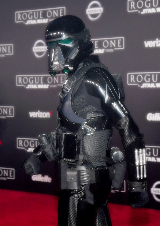 HOLLYWOOD, CA - DECEMBER 10: (EDITORS NOTE: Image was processed using digital filters) A death trooper character marches down the red carpet at the premiere of Walt Disney Pictures and Lucasfilm's "Rogue One: A Star Wars Story" at the Pantages Theatre on December 10, 2016 in Hollywood, California.   Ethan Miller/Getty Images/AFP