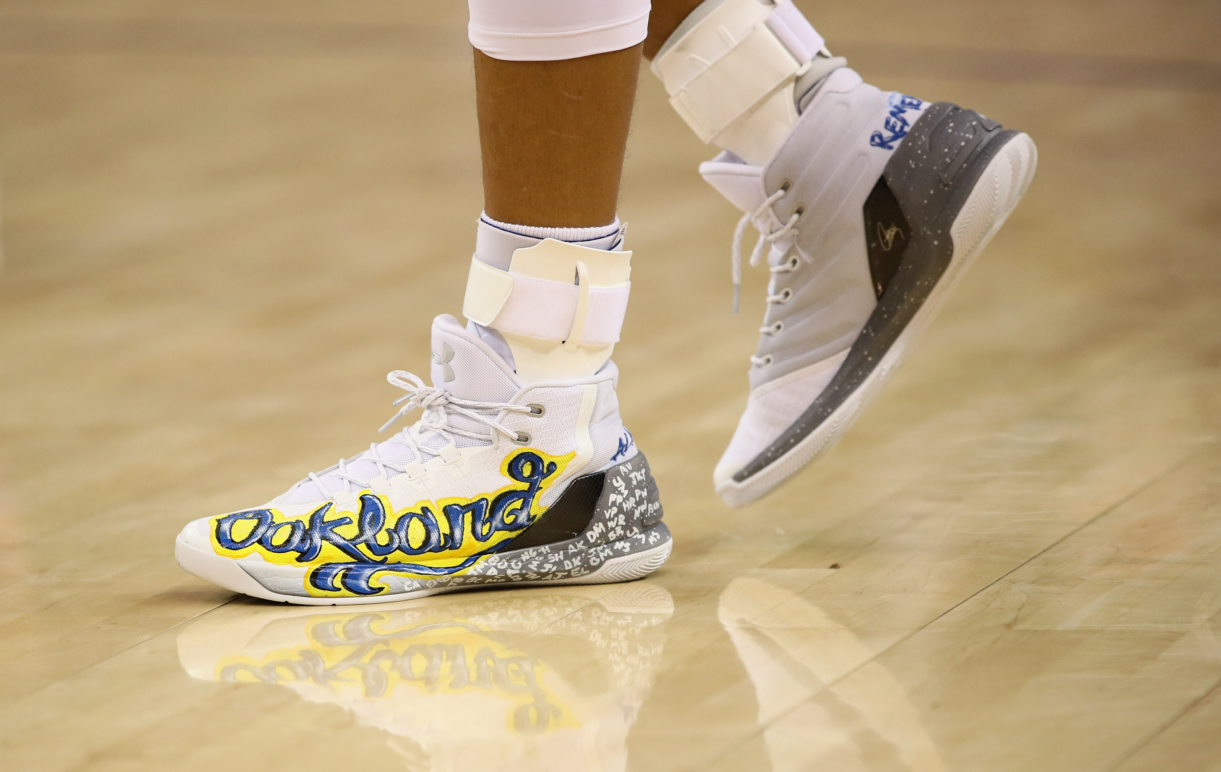 OAKLAND, CA - DECEMBER 15: A close-up of the shoes that Stephen Curry #30 of the Golden State Warriors wore during their game against the New York Knicks at ORACLE Arena on December 15, 2016 in Oakland, California. The shoes are a tribute to all the lives that were lost in the Ghost Ship warehouse fire in Oakland on December 2. NOTE TO USER: User expressly acknowledges and agrees that, by downloading and or using this photograph, User is consenting to the terms and conditions of the Getty Images License Agreement.   Ezra Shaw/Getty Images/AFP